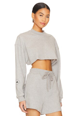 adidas by Stella McCartney True Casuals Cropped Sportswear Sweatshirt in Medium Grey Heather from... | Revolve Clothing (Global)