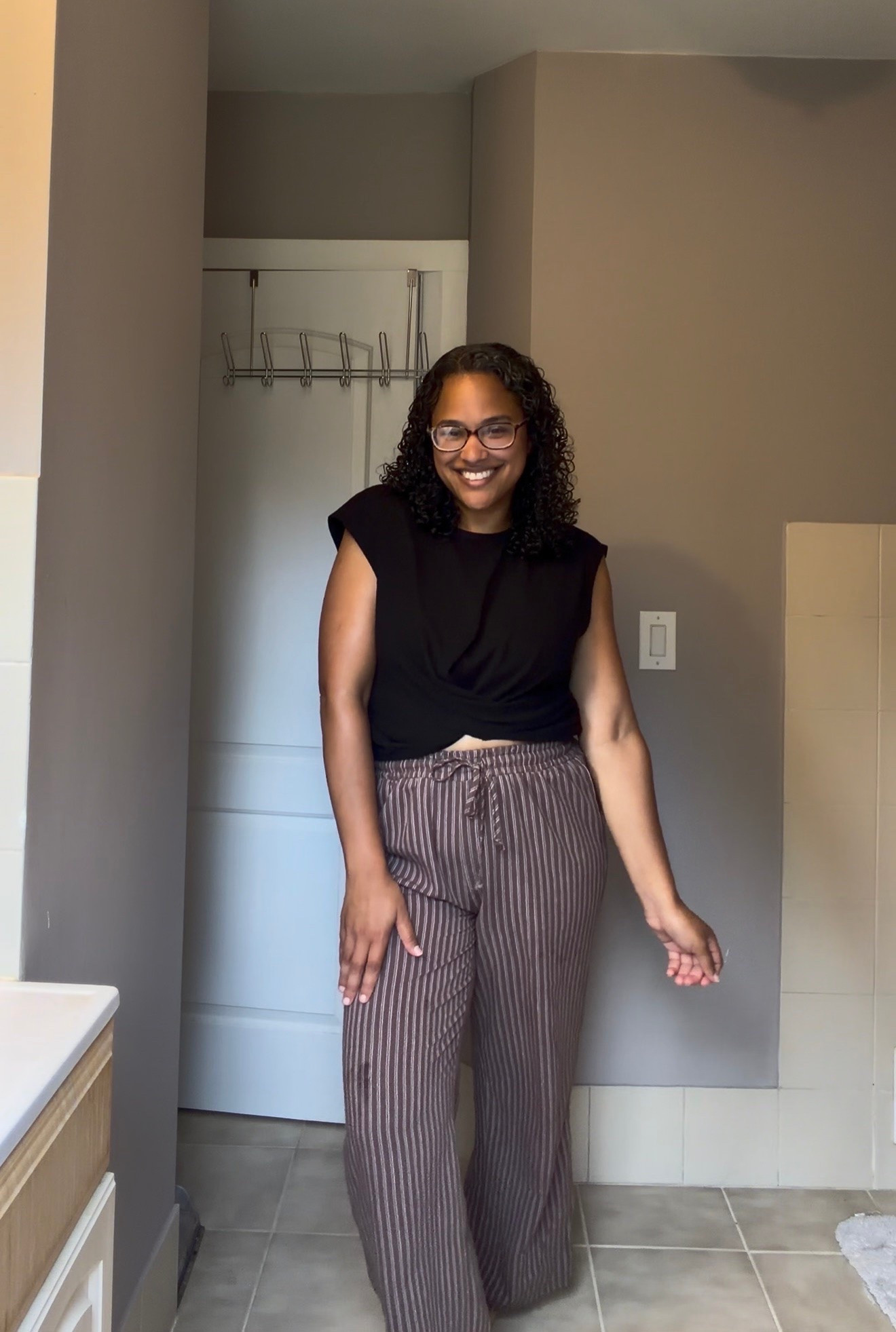 Easy, comfy + still looks put together 🤎 This striped wide leg pants outfit is the perfect everyday mom look! Paired with a black twist front top for an effortless casual outfit that works for running errands, lunch dates or everyday wear.

wide leg pants, striped pants, casual mom outfit, midsize fashion, everyday outfit, fall outfit, affordable fashion, comfy chic, casual style, mom style, neutral outfit

#LTKootd #LTKMidsize #LTKmomlife
