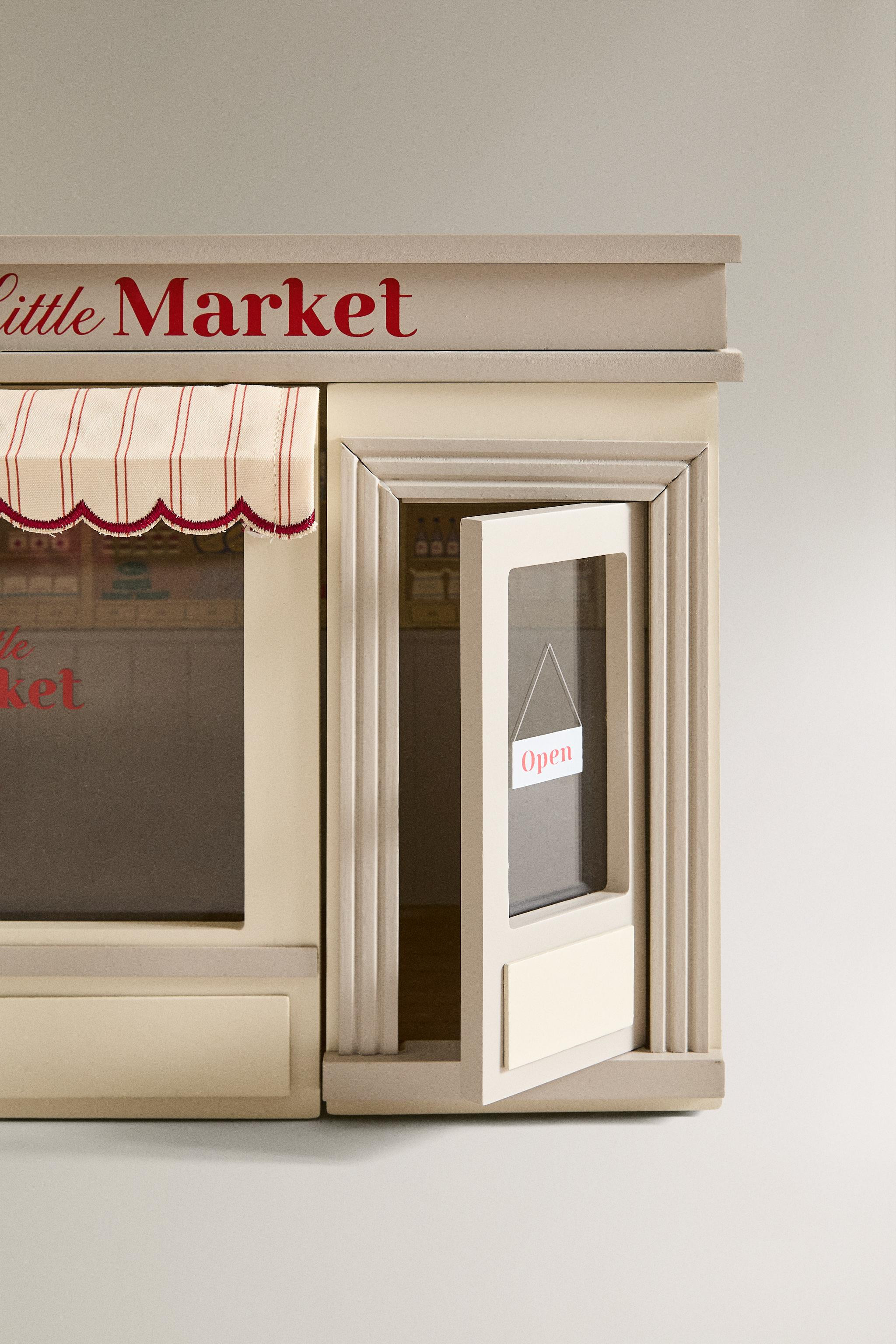 Kids wooden mini supermarket toy with a decorative facade, fabric awning and a sign with the text... | Zara US