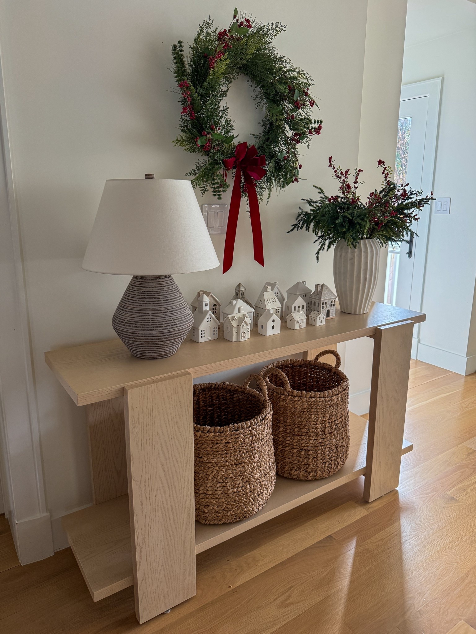 Console table styling for Christmas - I displayed my collection of Christmas village houses! 

#LTKCyberWeek #LTKSeasonal #LTKHoliday