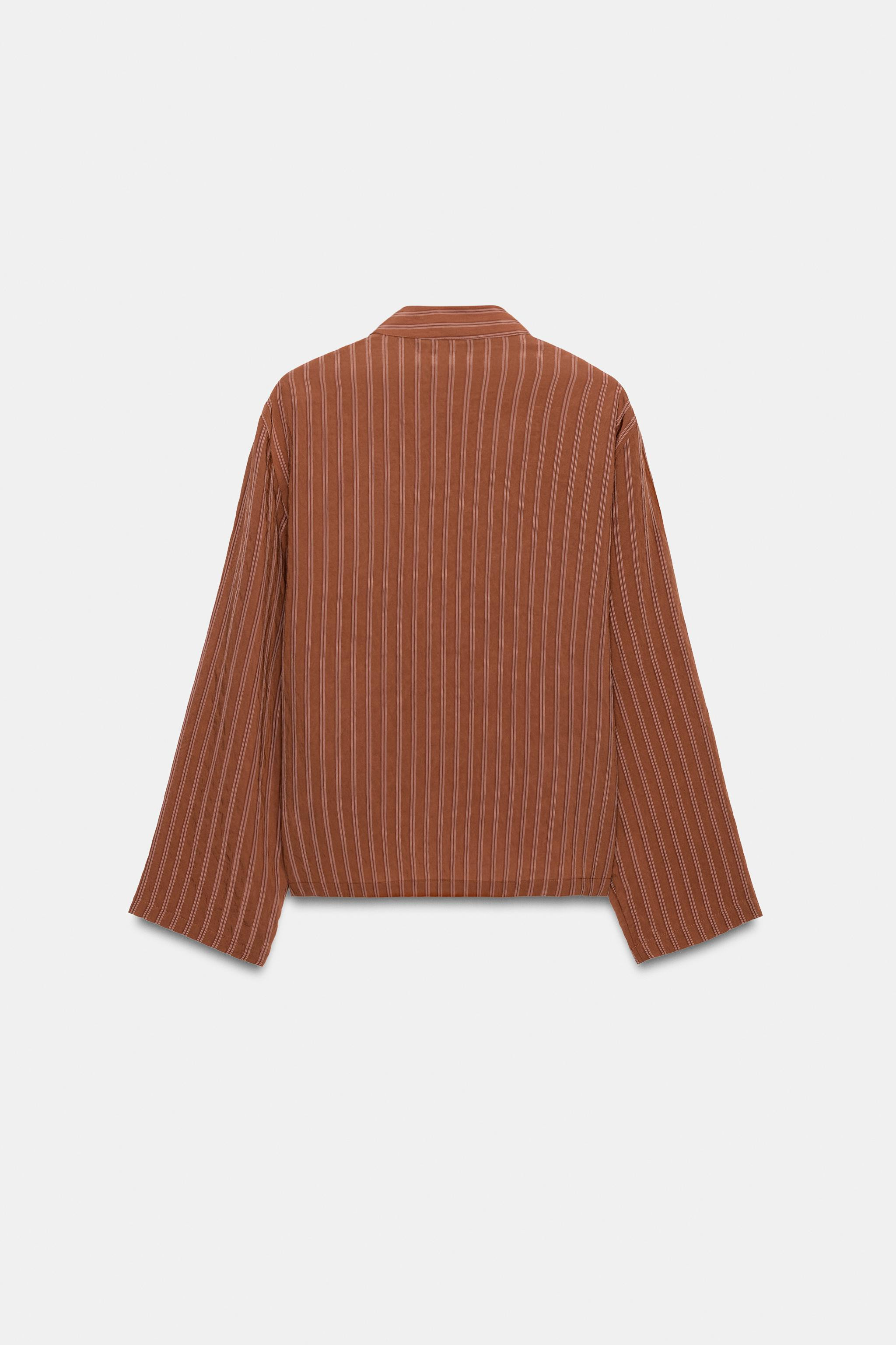 ZARA WOMAN COLLECTIONShirt made of a viscose blend. High neck and long sleeves. Patch pockets on ... | Zara US