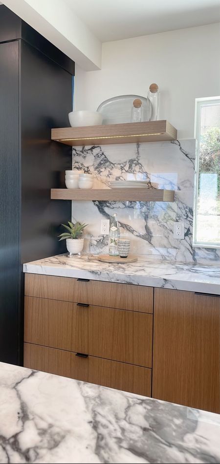Kitchen shelf styling 

Wood shelves, marble backsplash, plates, bowls, tableware, glass containers, home staging 

#LTKstyletip #LTKhome