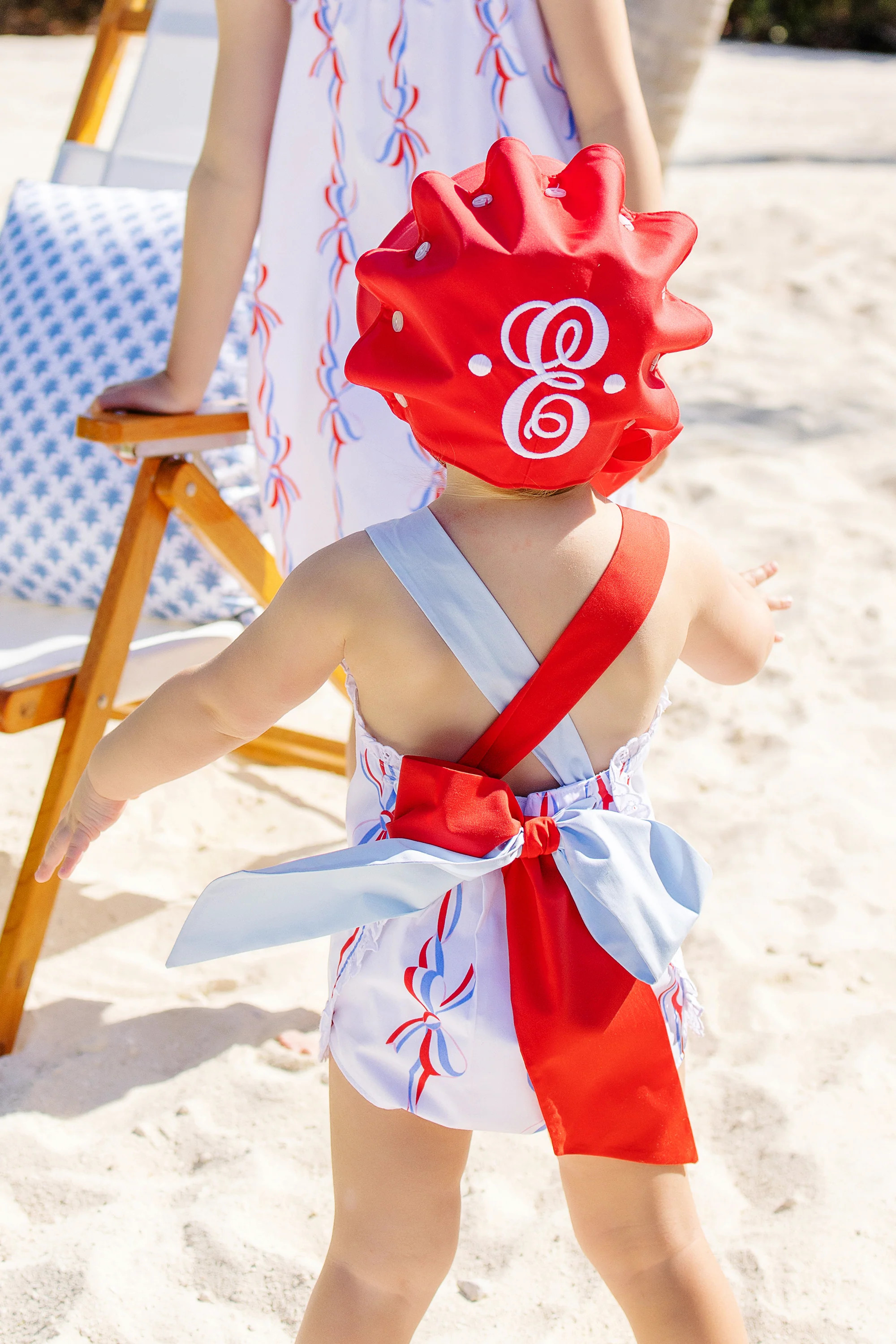 Sisi Sunsuit - America's Birthday Bows with Richmond Red and Buckhead Blue | The Beaufort Bonnet Company