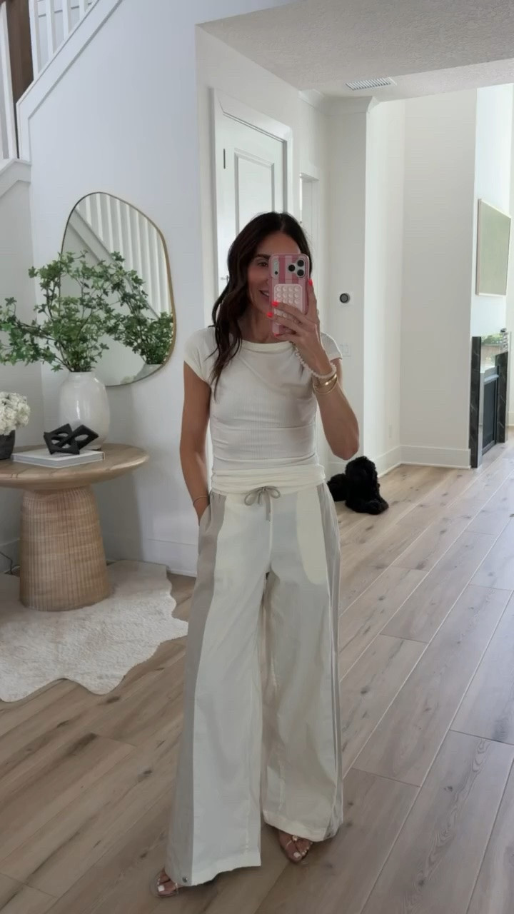 This is the definition of looking put together while feeling comfortable. The soft knit fabric drapes beautifully, the contrast side stripes give the wide leg pants a sporty touch, and the monochromatic color palette makes it look much more expensive than it is. Perfect for travel days, errands, or casual dinners.

matching set, wide leg pants, knit set, travel outfit, monochromatic outfit, casual chic, lounge set, everyday style, neutral outfit, comfortable fashion, annabrstyle

#LTKootd #LTKActive #LTKOver40