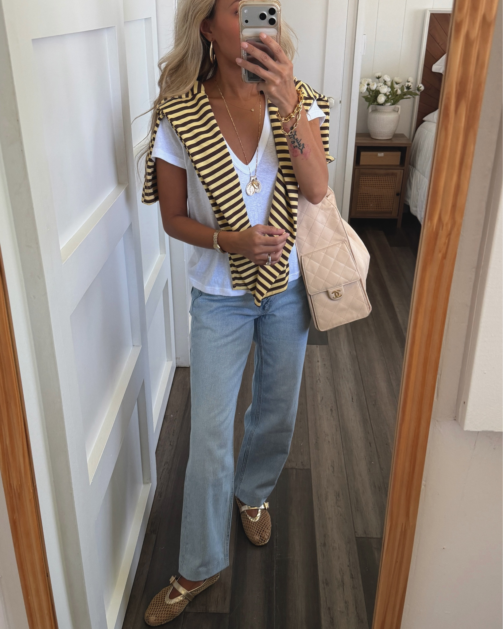 OOTD. Size 2 jeans, xs tee, xs striped tee, Alaia shoes, chanel25 bag. 

#LTKOver40 #LTKootd #LTKPetite