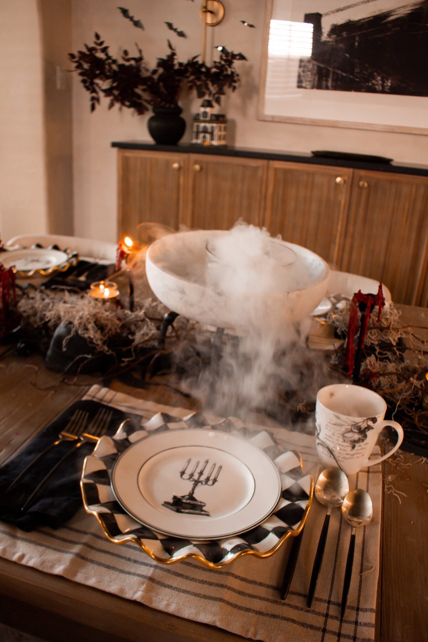 Halloween, but make it moody and modern 🖤 Layering dark tones, warm metallics, and just the right amount of spooky for an elevated Halloween table.

#LTKHome #LTKSeasonal