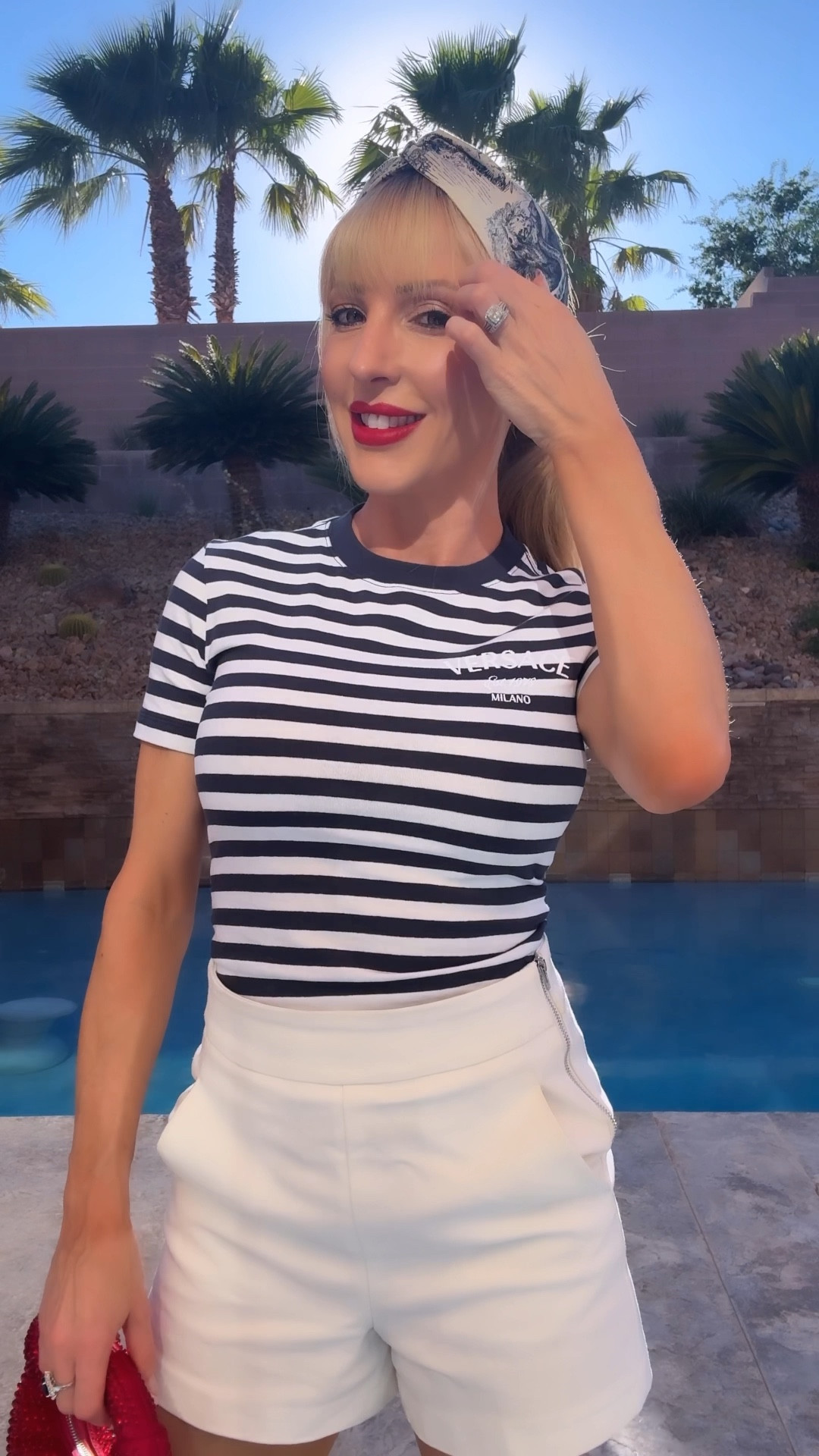 4th July outfit, July 4th outfit: Versace navy and white stripe tshirt in the Versace sale, tailored white shorts, red lipstick, red crystal clutch bag and Dior bandana 🇺🇸 

#LTKStyleTip #LTKVideo #LTKSeasonal