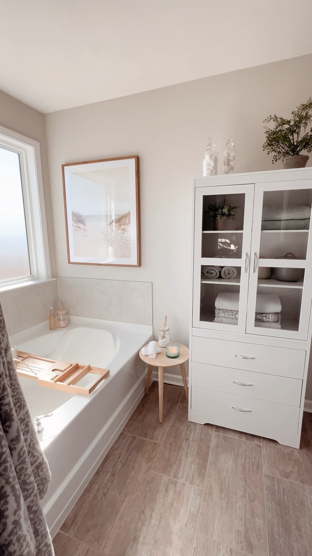 Say hello to our new bathroom addition. Took me a hot minute to build this dang thing but I did it! 💪🏼 

Changing out the hardware soon.. stay tuned 🤍

#bathroom #bathroomdesign #interiordesign #design #interior #home #homedecor #bathroomdecor #kitchen #architecture #shower #bath #renovation #homedesign #bathroomremodel #decor #bathroominspo #bathroominspiration #bathroomrenovation #tiles #toilet #bathroomideas #interiors #construction #tile #kitchendesign #bathroomcabinets #shelfdecor #bedroom #bathroomgoals #storage #shelves #shelving #bathroomstorage #organize #ltkdecor #ltkamazon #amazonfinds #amazon #bathroomessentials #bathessentials #towels #bathtowels #stool #bathcaddy #canisters #candle #artwork #framedart #picture #landscapeartwork #beach #spa #spabathroom 