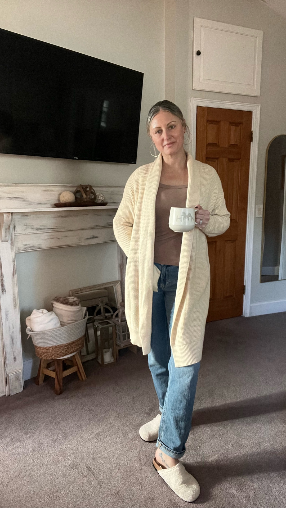 Casual mom outfit idea 🤍 Boyfriend jeans, neutral long sleeve top, oversized cream duster cardigan, and sherpa clogs. Easy everyday look for errands, school pickup, or cozy days out.

All pieces linked here.

#LTKmomlife #LTKmorningroutine #LTKootd