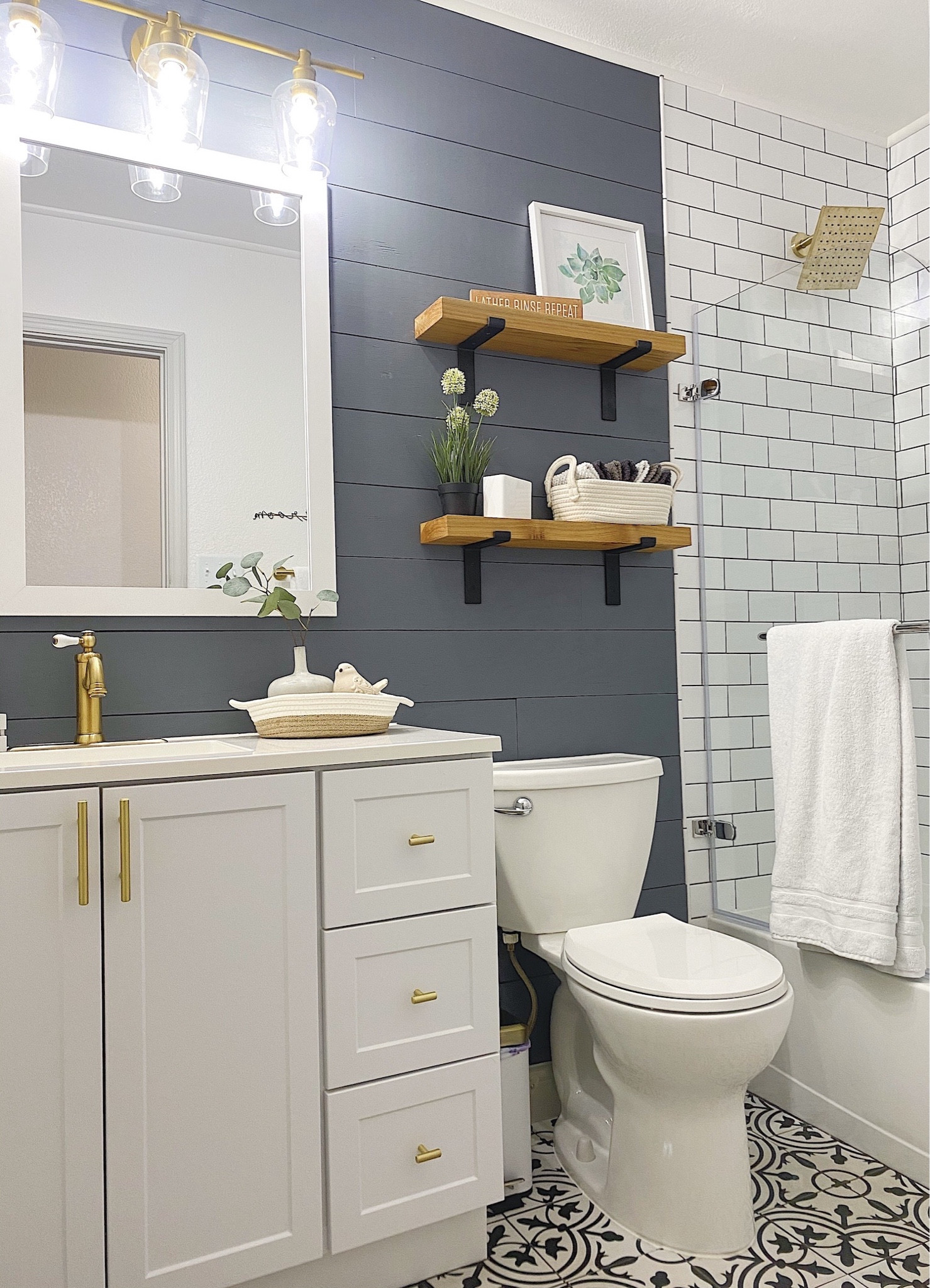 Bathroom styling! 

White and gold bathroom, dark bathroom, farmhouse bathroom, minimalist bathroom, neutral bathroom, bathroom decor, bathroom storage, bathroom vanity, white vanity, single sink vanity, vanity and mirror set, gold towel rack, gold hand towel ring, gold drawer pulls, gold handles, black and white Moroccan tile

#founditonamazon #amazonhome

#LTKsalealert #LTKhome #LTKstyletip