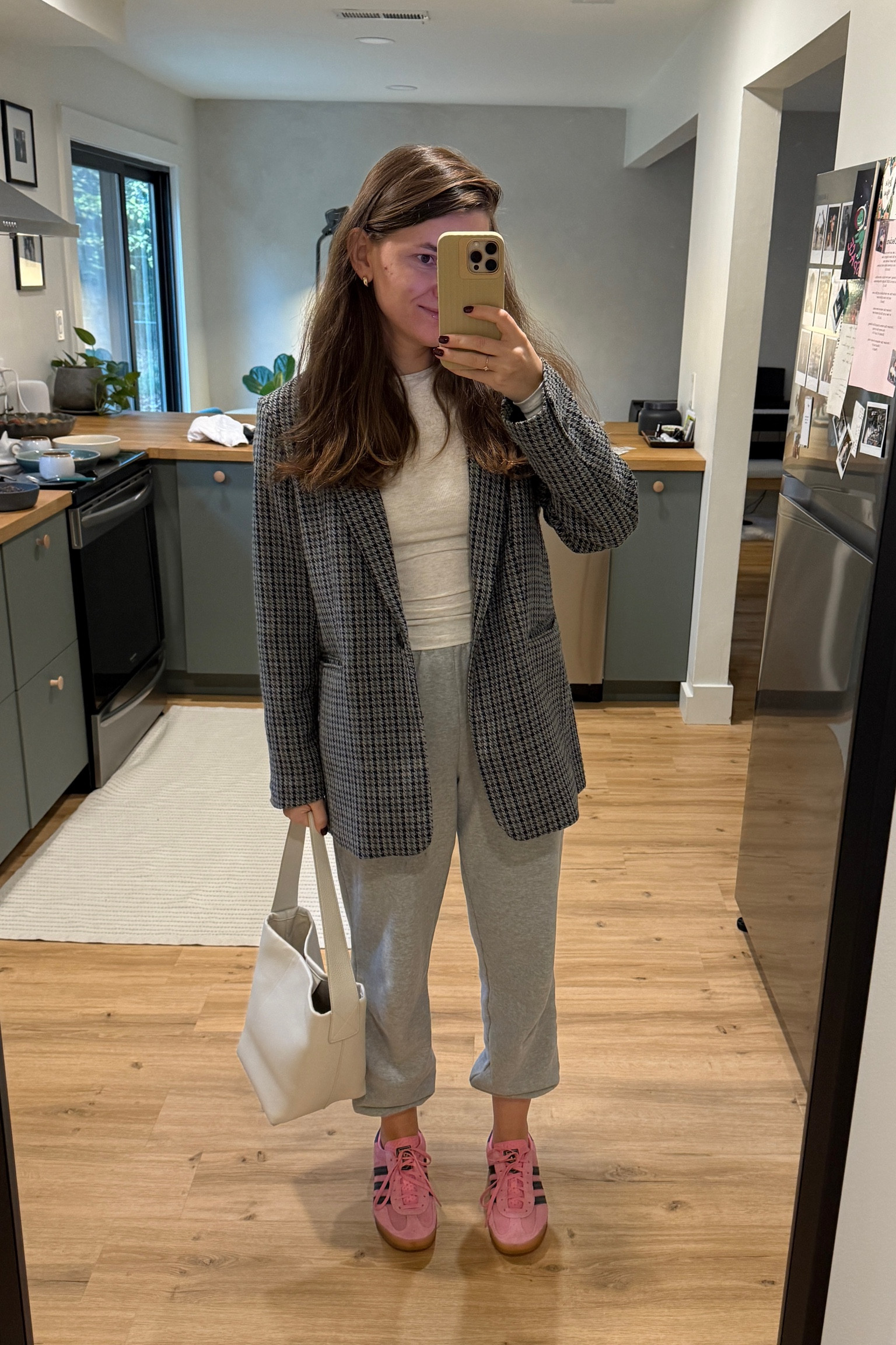 Sport casual look 

Grey sweat pants / beige long sleeve / blazer / of white tote bag / pink adidas 

#LTKStyleTip