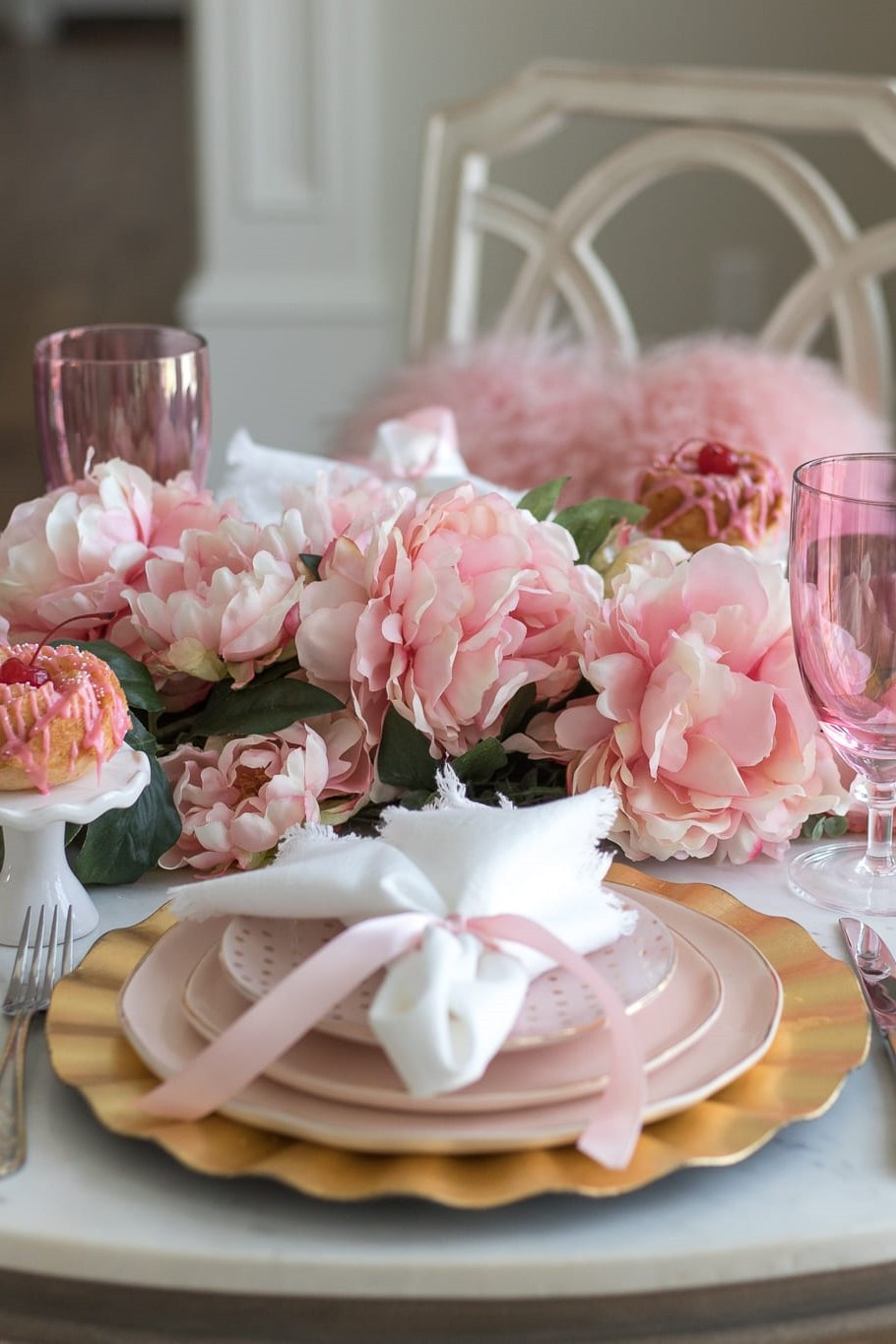 Soft pink peonies + gold layered place settings = the dreamy tablescape everyone is saving right now 🌸✨ Shop this romantic spring dining look on LTK before your next brunch or bridal shower! #LTKhome #TablescapeInspo #PinkAesthetic #SpringHosting #HomeWithHollyJ #ShopHollyJHome 

 #LTKfoodie #LTKSeasonal #LTKHome
