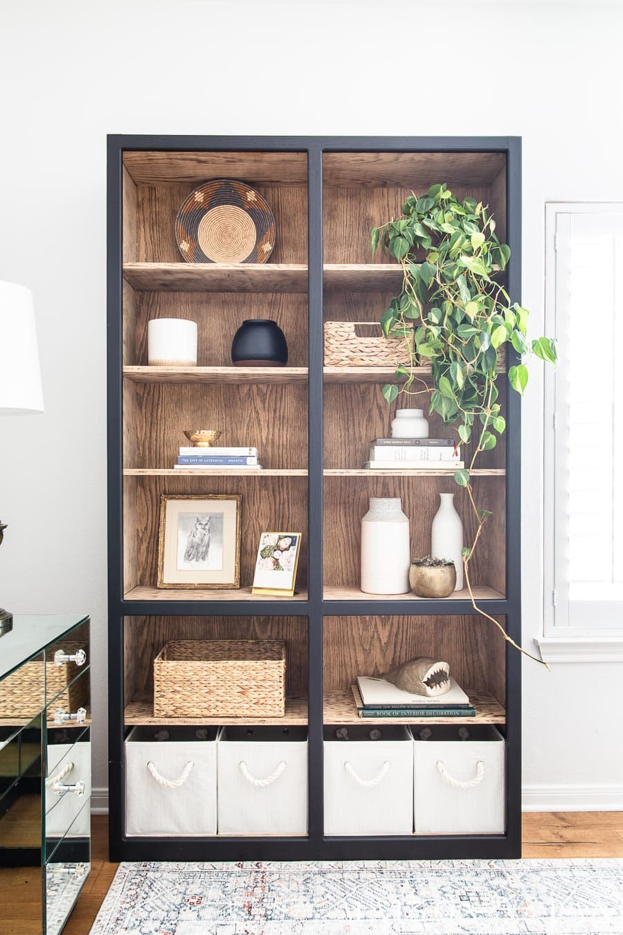 Giving this bookcase a fresh look with a mix of sleek black and warm oak—proof that a little paint and stain can completely transform a space. 

It’s the perfect balance of modern and classic, and I’m sharing all the materials you need to recreate the look! 

 #LTKHome