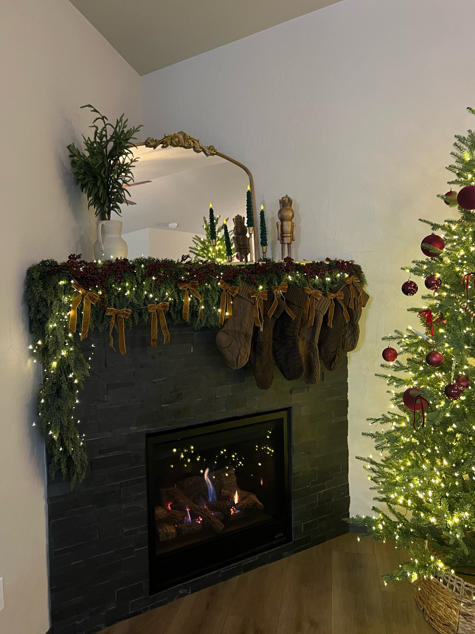 #homedecor #christmas #mantle #fireplace #garland #mirror #christmasdecor 

#LTKhome #LTKfindsunder50 #LTKSeasonal