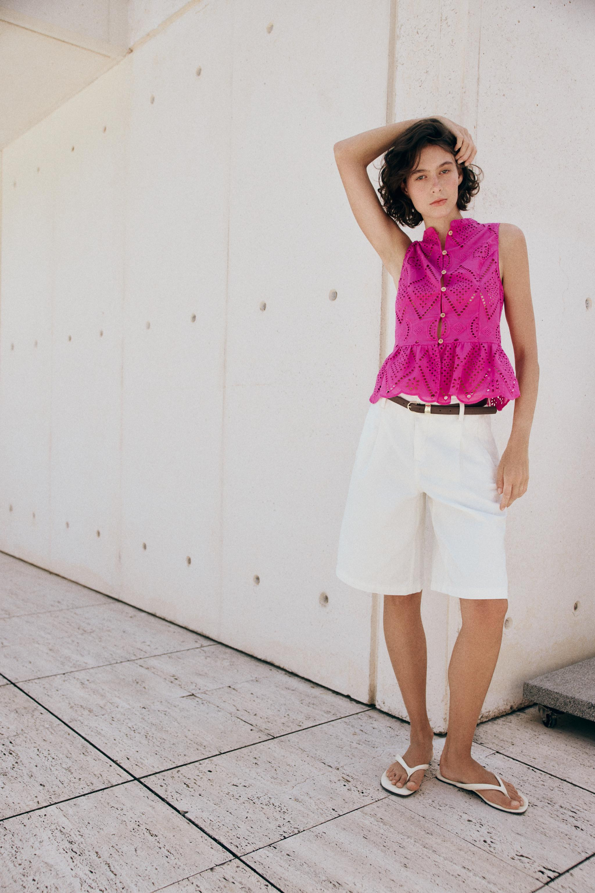 Round neck sleeveless top. Tonal eyelet embroidery detail. A-line hem. Front button closure. | Zara US