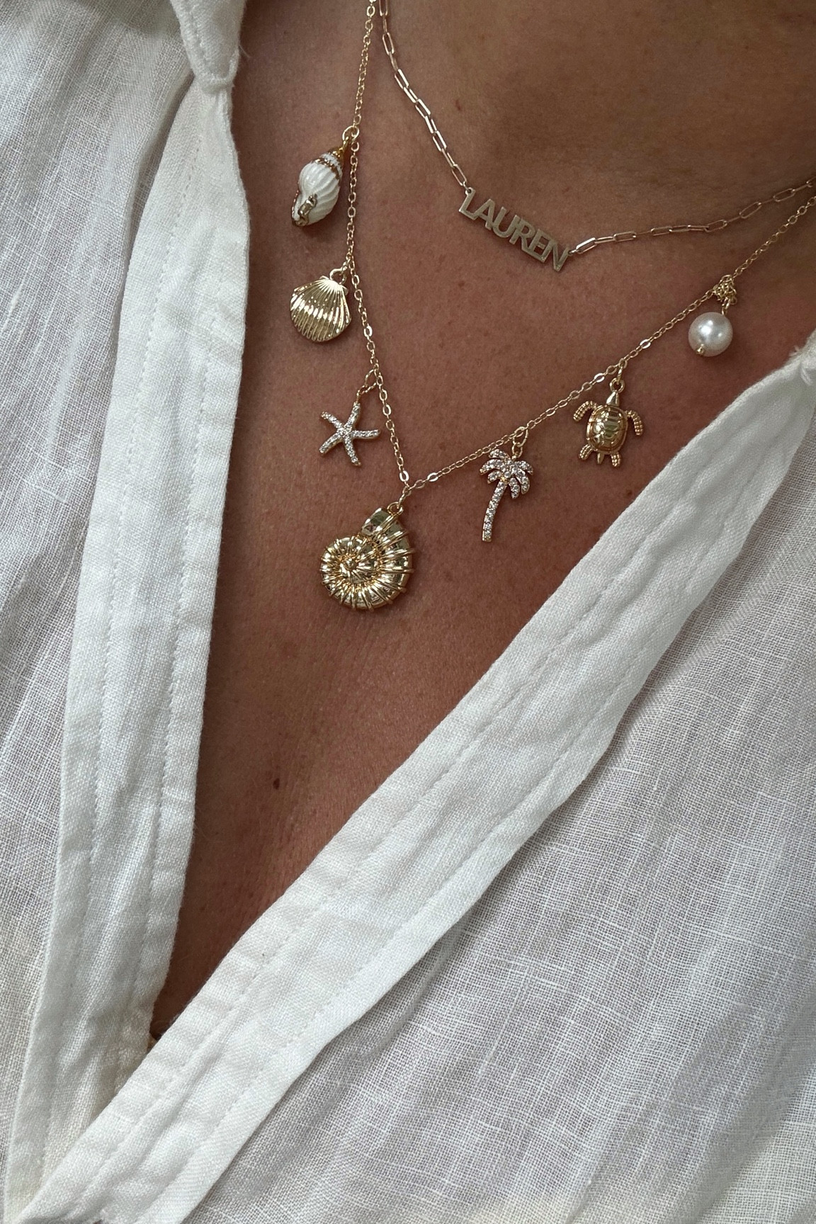 Seashell necklace and name necklace. The quality is 🤌🏼 Now 45% off everything on @thesiskiss! Xx 

#LTKFindsUnder50 #LTKSeasonal