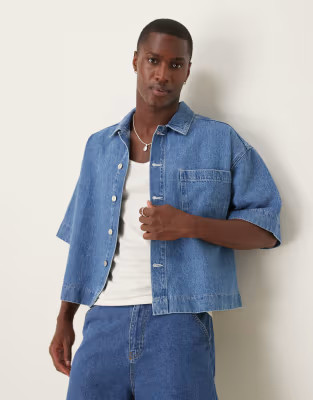 ASOS DESIGN boxy oversized denim shirt in mid wash | ASOS (Global)
