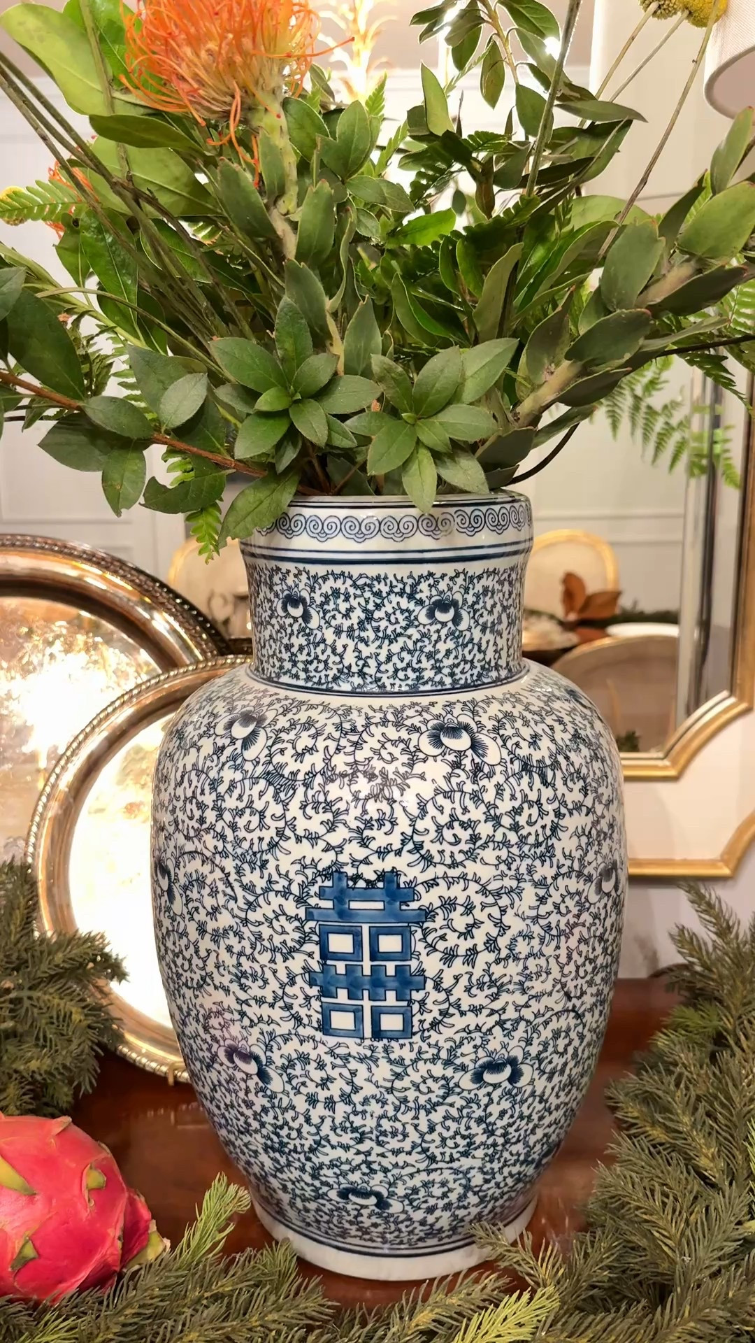 Blue and white vase 🫶🏻 it’s large! I added a combination of store bought flowers and greenery from my yard to create a simple holiday arrangement that pops with just the right amount of color. The garland is from Ballard and has been a Christmas decor staple for me over the years  

#LTKHome #LTKSeasonal #LTKHoliday