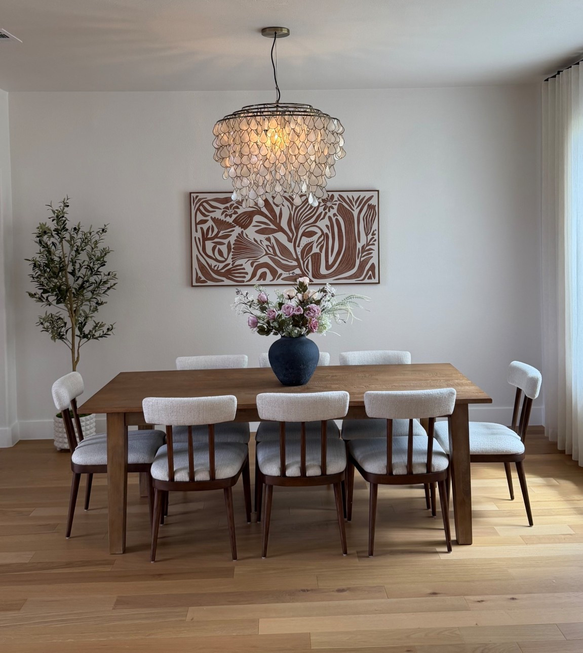 We had ordered a table for the dining room MONTHS ago and it kept getting pushed back. I got tired of waiting, so I found this one instead. I’m SO happy I did. It’s 100% wood, so beautiful, and feels really well made! honestly perfect for this space.
