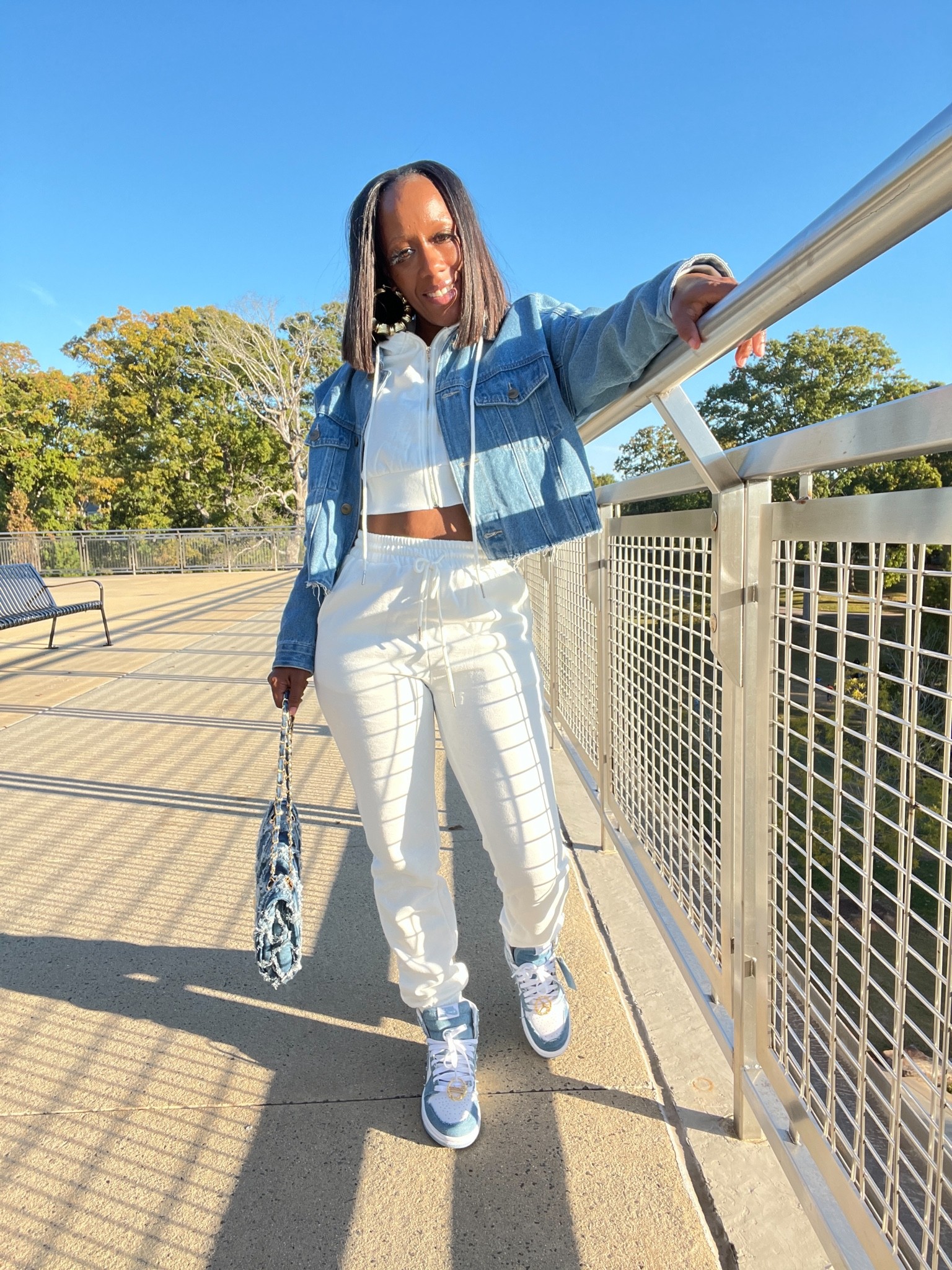 Fall outfit ideas 2022. Cropped hoodie and sweatpants with denim jacket. Denim handbag. Air Jordan 1 “Denim"

#LTKitbag #LTKshoecrush #LTKstyletip