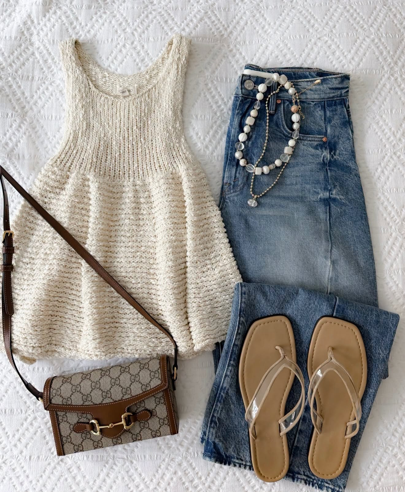 This is my answer to getting excited about fall clothes when it’s still warm outside. The open knit tank gives you that cozy texture without the sleeves, and I love it with relaxed denim, simple sandals and a few layered necklaces.

early fall outfit, transitional fall style, knit tank top, open knit top, relaxed denim, casual denim outfit, fall neutrals, layered necklaces, flat sandals, everyday fall outfit, annabrstyle

#LTKSeasonal #LTKootd