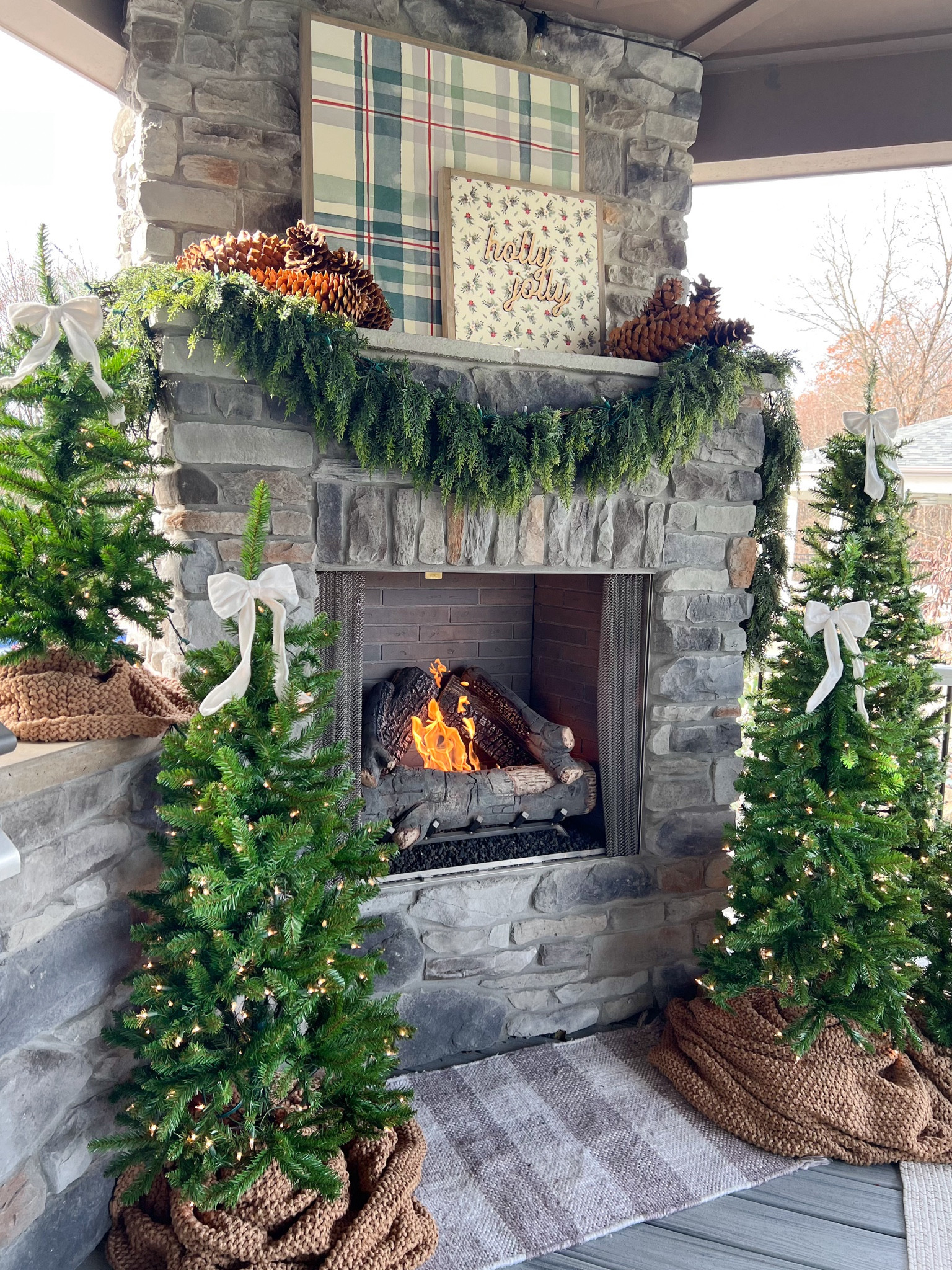 Code BEYOND can be used site wide at Joyfully Said, which is where both artwork signs are from. The white bows are from Kirkland’s (not linkable on LTK). I used a blanket for tree skirts and cut the blanket up into pieces so that I had enough for each tree. These pinecones are called Sugar Pinecones. You can find them at Hobby Lobby this time of year or your local greenhouse/nursery usually has them! I used one 6.5 tree, two 4.5ft trees and two 3ft trees for this cluster. All are prelit! 

#LTKHoliday #LTKHome #LTKSeasonal