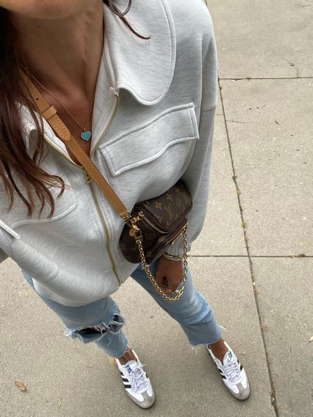 Zip up and mother jeans! Ripped with worn 