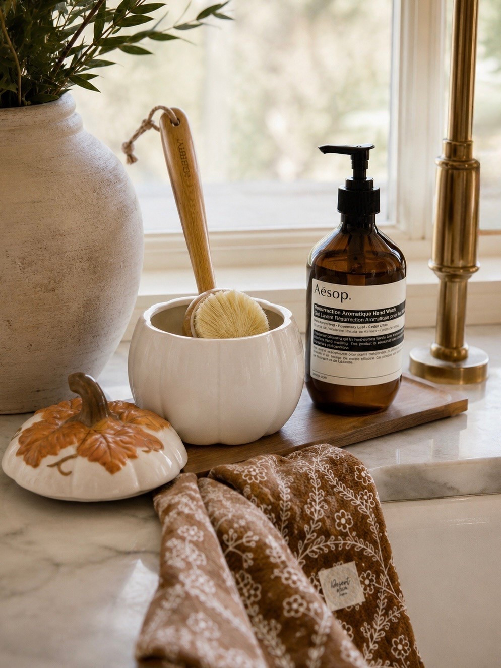 FALL KITCHEN SINK STYLING

Follow @farmtotablecreations on Instagram for more home finds and styling inspiration.

The smallest seasonal touches can completely transform a kitchen. This cozy sink-side vignette layers warm wood, rich amber glass, soft autumn tones, and a charming ceramic pumpkin for an elevated look that’s both beautiful and practical. The pumpkin doubles as a stylish holder for the dish brush, making everyday essentials feel intentional.

Perfect for creating a warm, welcoming kitchen all season long.

#KitchenDecor #FallDecor #AmazonHome #StudioMcGeeStyle

#LTKHome #LTKSaleAlert #LTKSeasonal