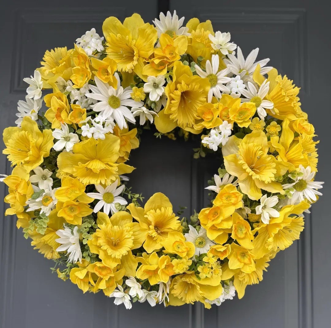 Brighten your space with this cheerful spring wreath by BeautifulGaiaDesigns. Crafted on an 18-inch grapevine base, it’s beautifully decorated with sunny yellow daffodils, sweet white daisies, and delicate seasonal blooms that capture the fresh feeling of a garden in full bloom. The high-quality faux florals create a vibrant display perfect for front doors, entryways, or brightening any room, and it arrives ready to store in its reusable box for seasons to come. #springdecor #daffodilwreath #frontdoordecor #ltkhome #homedecorfinds #seasonaldecor #farmhousestyle 

#LTKSeasonal #LTKHome