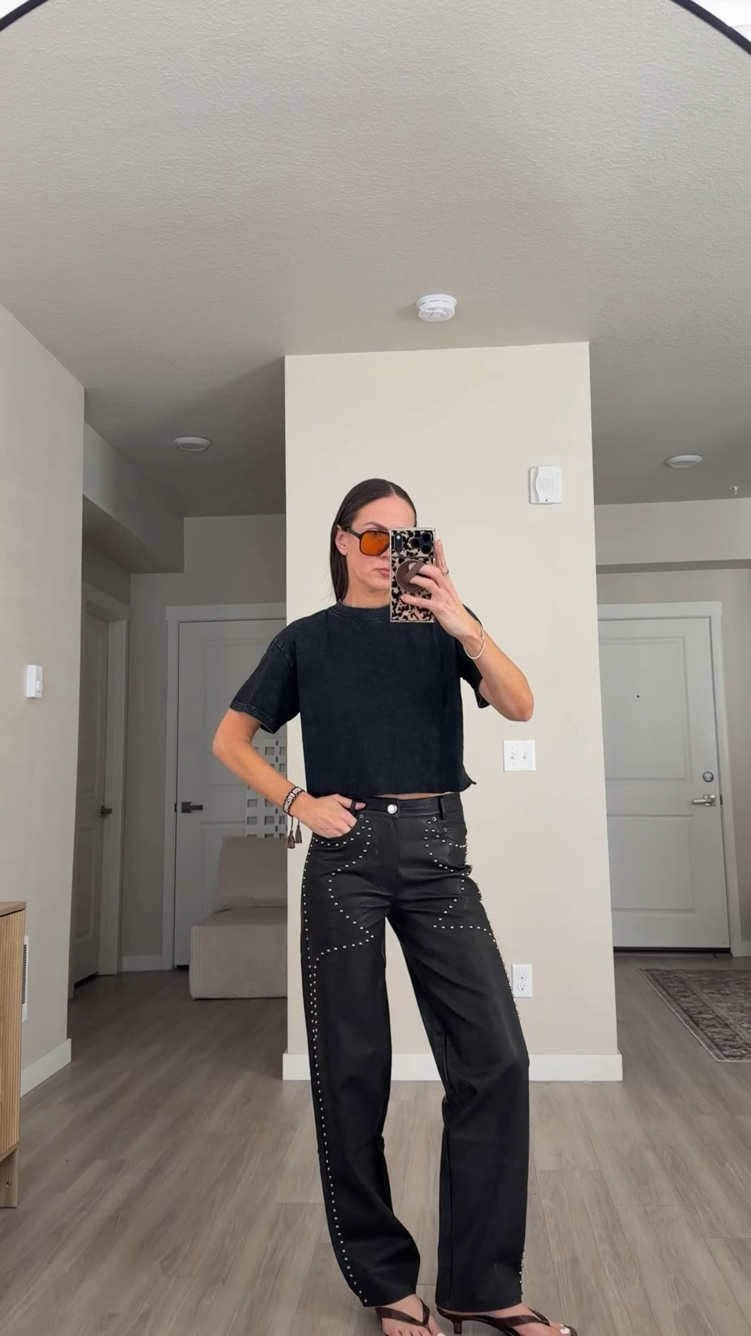 Wearing size small ( 4 in pants) 
Black faux leather pants 
#tiktok #fauxleatherpants #studdedpants