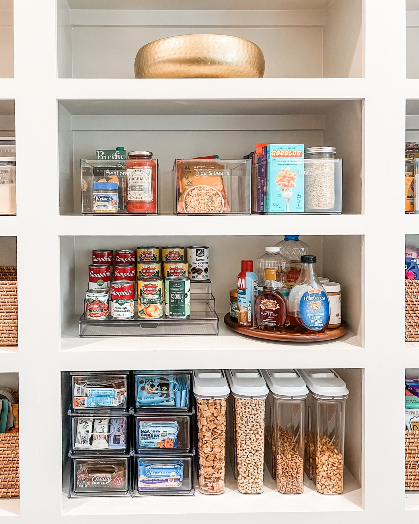 Oh look, it's a perfect picture of some of our very favorite pantry products! We love using clear containers because they keep everything contained, but also allow you to visually assess what you've got. Add in an acacia lazy susan, snack drawers, and something pretty, and you've got the perfect pantry! 

 