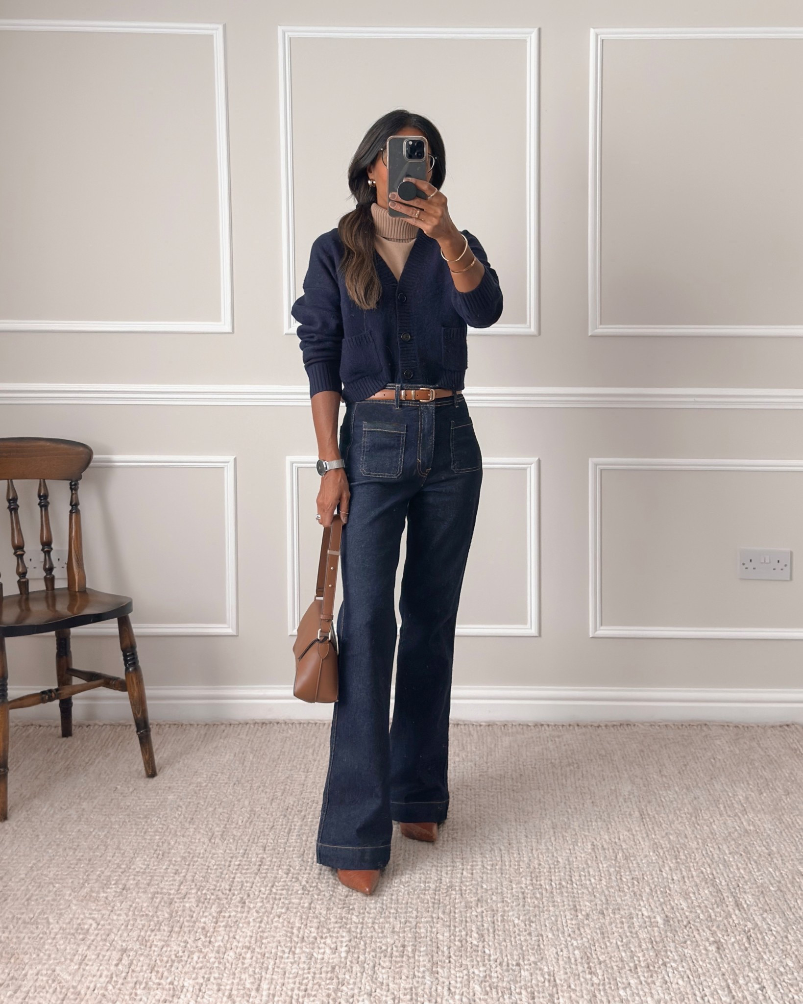 Pocket dark denim jeans - wearing my regular size - UK size 8

Navy cardigan - wearing size XS. You have 2 options to purchase. The first is from Uniqlo and is the one I’m wearing here. This is a boxy fit so would definitely recommend sizing down. With pockets.

The second option is another cardigan that’s really similar from H&M which I also own - they had this last Autumn too. I’d recommend XS if you’re a similar build to me. Quite oversized and this one doesn’t have pockets.

Tan roll neck - mine is old but will link similar for you.

#LTKautumn #LTKuk #LTKeurope