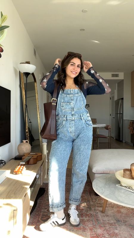 How to style free people Ziggy overalls! These are truly the most flattering overalls I have ever found, I have three colors! Love pairing them with a girly lace top and sneakers. Feels really functional but still cute! :)

Sizing:
Overalls - size down once, S 
Top - M
Sneakers - men’s size 6 = women’s 7.5

#LTKfindsunder100 #LTKVideo #LTKSeasonal