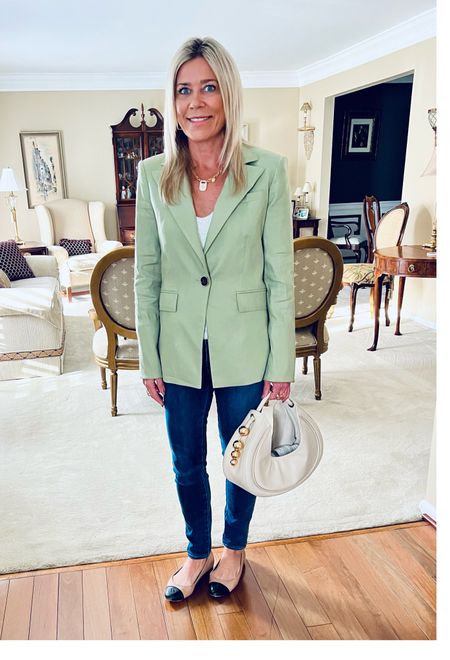 Travel outfit style…love the polished look of a blazer as airplanes get chilly. Paired this safe green linen blazer with a white sequin tank top to dress up the outfit. High-waist button front jeans cinch you in at the waist & are so comfortable fir travel. Chic small handbag + jewelry dress up the look & look polished in flight and when you land ✈️.

#LTKtravel #LTKshoecrush