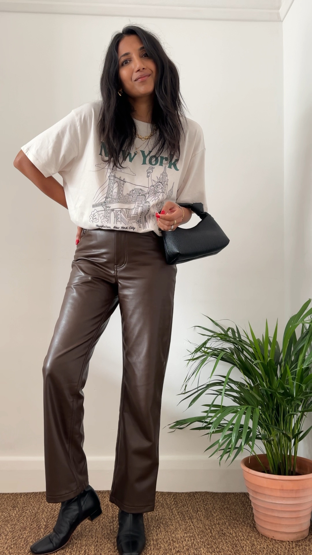 Evening out 
Pleather trousers, brown trousers, graphic T-shirt, slogan tshirt, black coat, ankle boots, dinner outfit 

#LTKVideo #LTKeurope #LTKover40