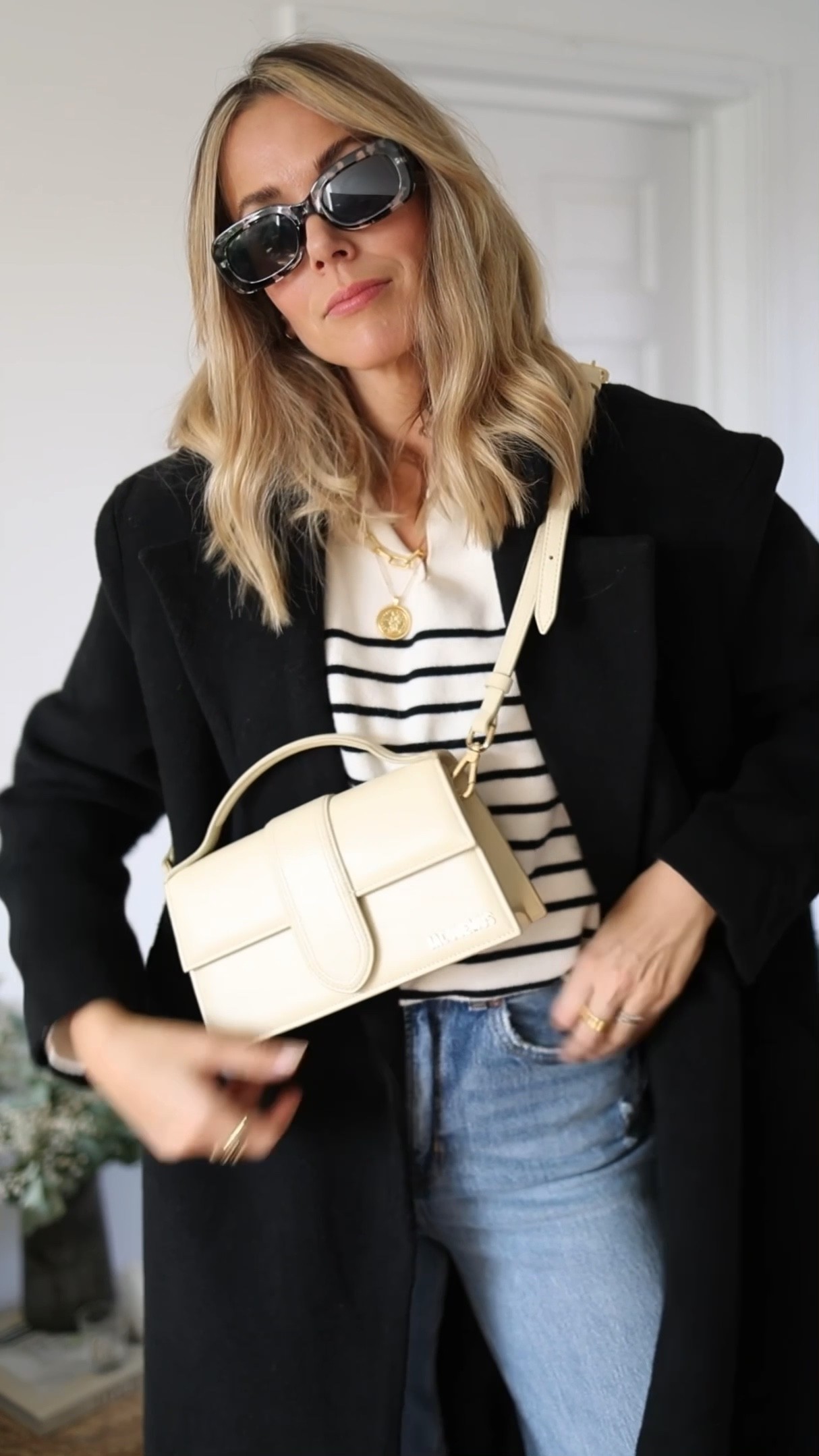 Stripe knit 
Black coat
Ugg ultra mini
Cross body bag 
Monica Vinader code: EMILYT20 

#LTKSeasonal #LTKstyletip #LTKeurope