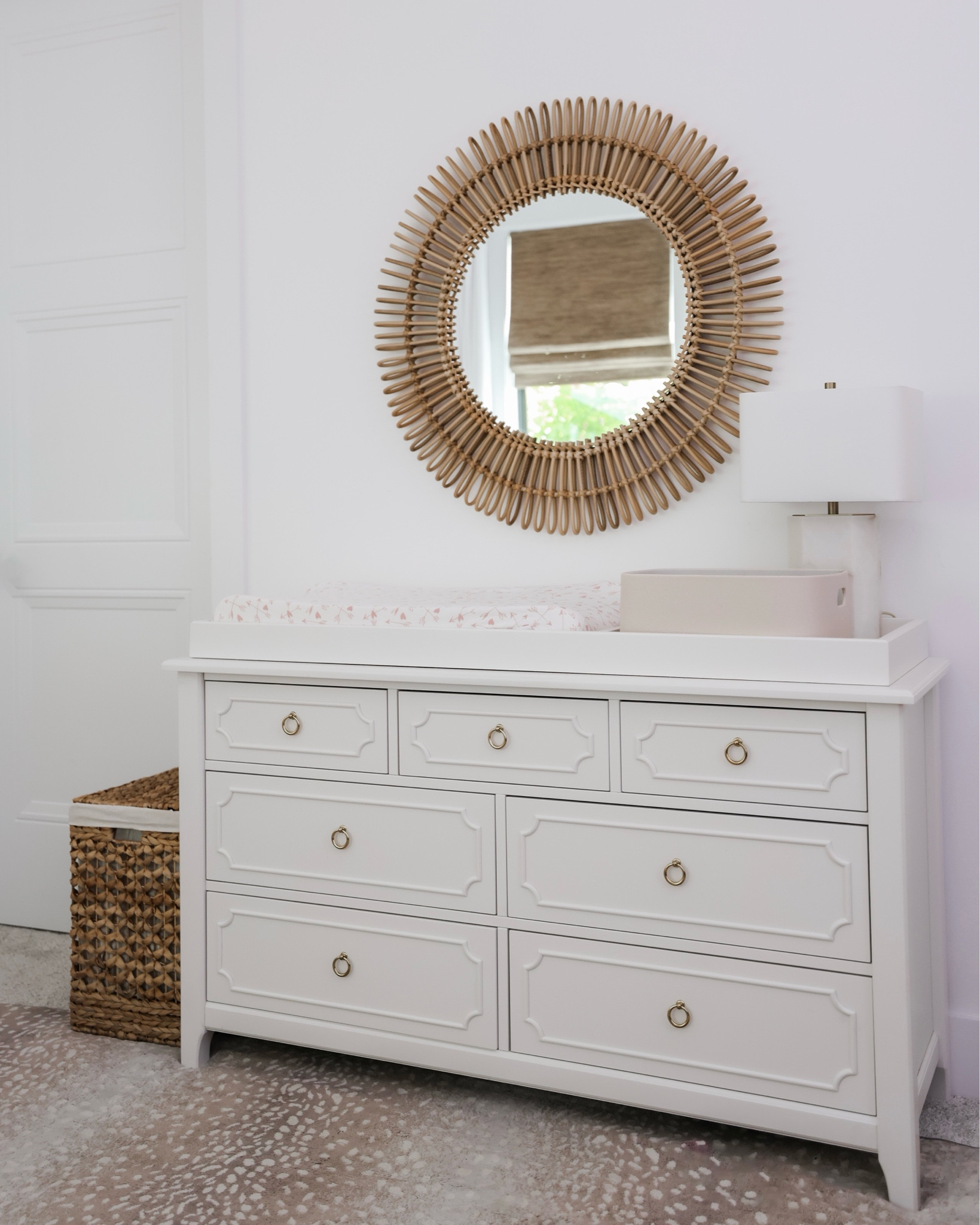 Girl nursery changing table! 

Round mirror, starburst, lamp, rug


#LTKhome #LTKstyletip