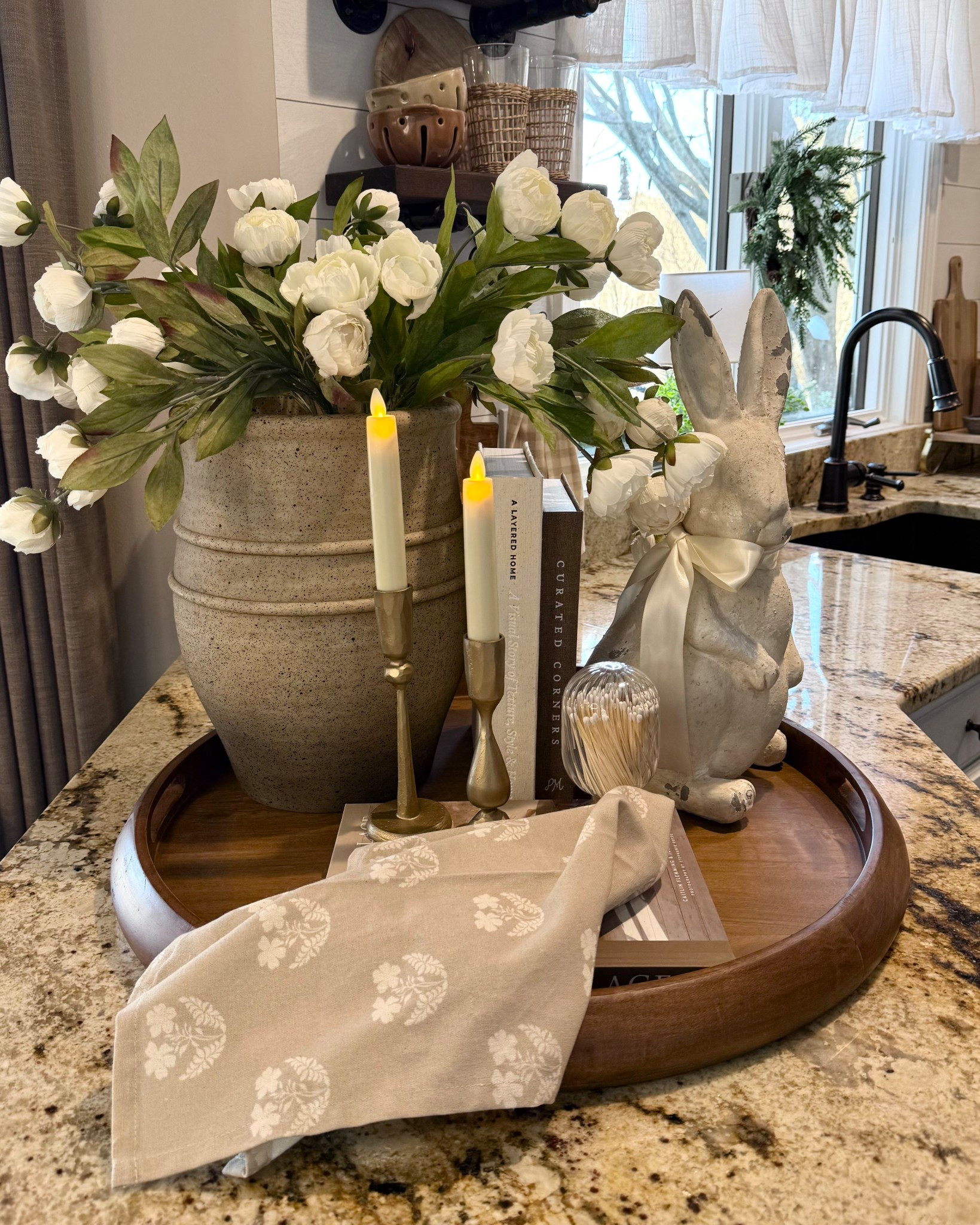 Early Spring Centerpiece Idea with Faux Terracotta Vase + Hidden Storage Books

Follow @farmtotablecreations on Instagram for daily home decor and styling inspiration.

This early spring centerpiece is such an easy way to refresh your home for the season. The oversized vase looks like heavy aged terracotta, but it’s actually lightweight plastic — such a beautiful designer-inspired find that looks so high-end.

I styled it with 12 soft neutral peony stems for a fresh, timeless look, and layered in warm brass candlelight and a sweet bunny accent for the perfect seasonal touch.

And those decorative books are secretly hidden storage… the top opens so you can tuck away matches, remotes, or little everyday essentials while keeping everything looking beautifully curated.

Simple, cozy, and perfect for spring styling.

#springdecor #centerpieceideas #homestyling #decorativebooks #neutraldecor #springfinds #candlesticks #amazonhomefinds #livingroomdecor #cozyhome



#LTKHome #LTKSaleAlert #LTKSeasonal