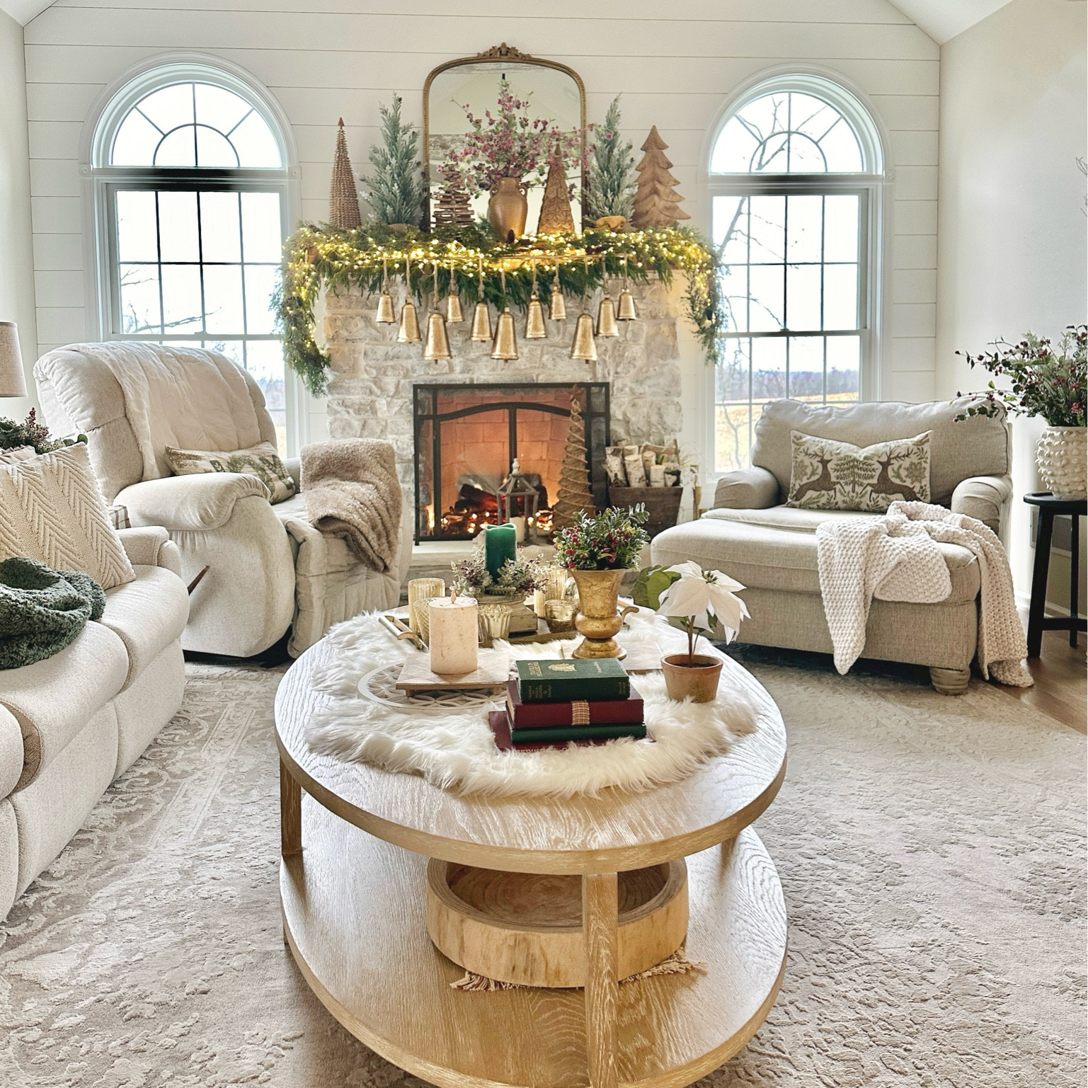 Christmas gold bells, mantle mirror, faux fur table runner, poinsettia, tabletop Christmas trees, twinkle lights, coffee table decor, textured vase

#LTKSeasonal #LTKHoliday #LTKhome