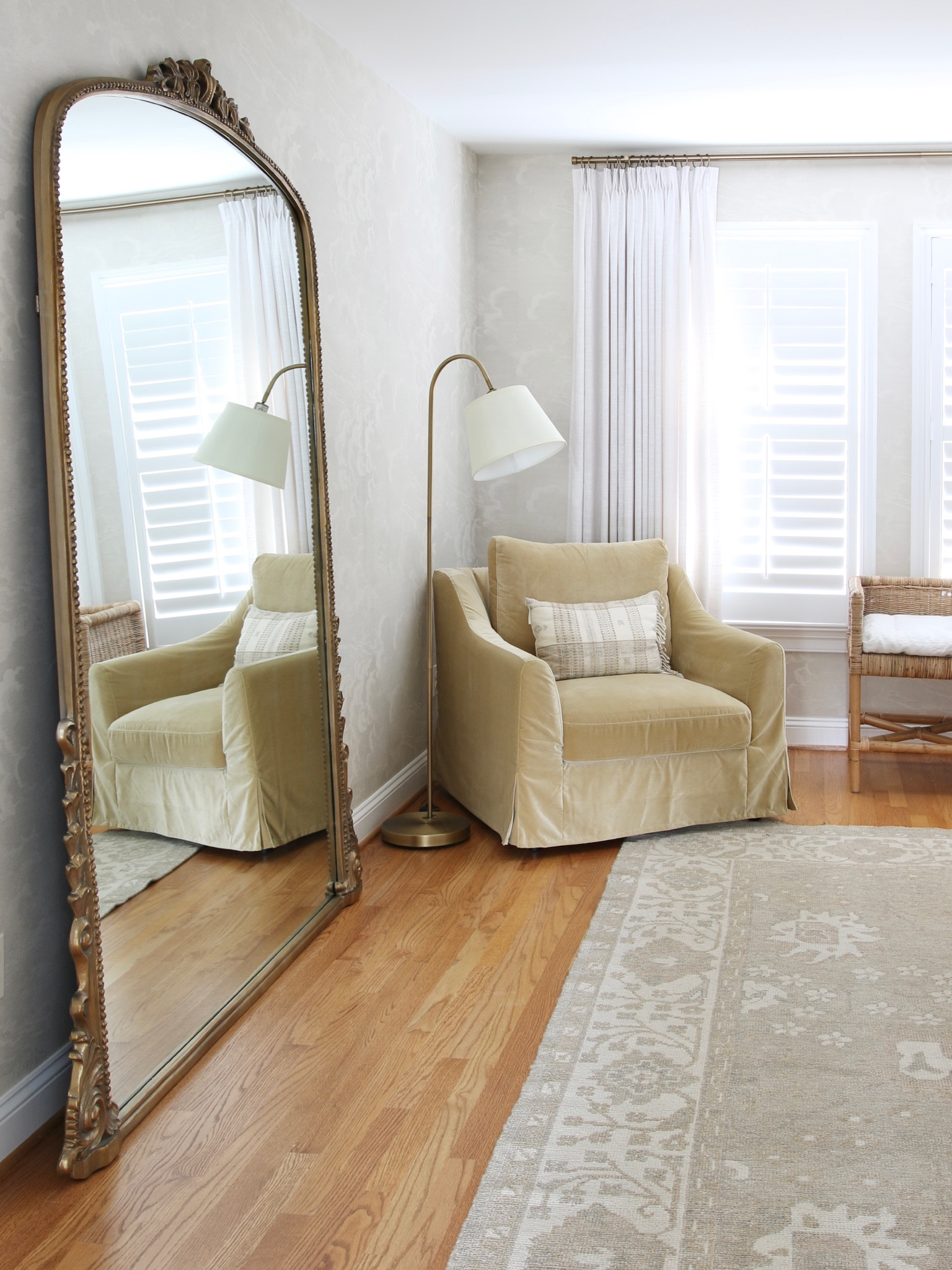 Here is a view that ties the Anthro gleaming primrose mirror to the window on the far wall. The view includes wallpaper from McGee and Co, a Safavieh hand knotted rug and pinch pleated drapes from Amazon and a rattan and metal floor lamp from Overstock. Armchair is Farlov from IKEA but the slipcover has been discontinued 

#LTKhome #LTKFind #LTKstyletip