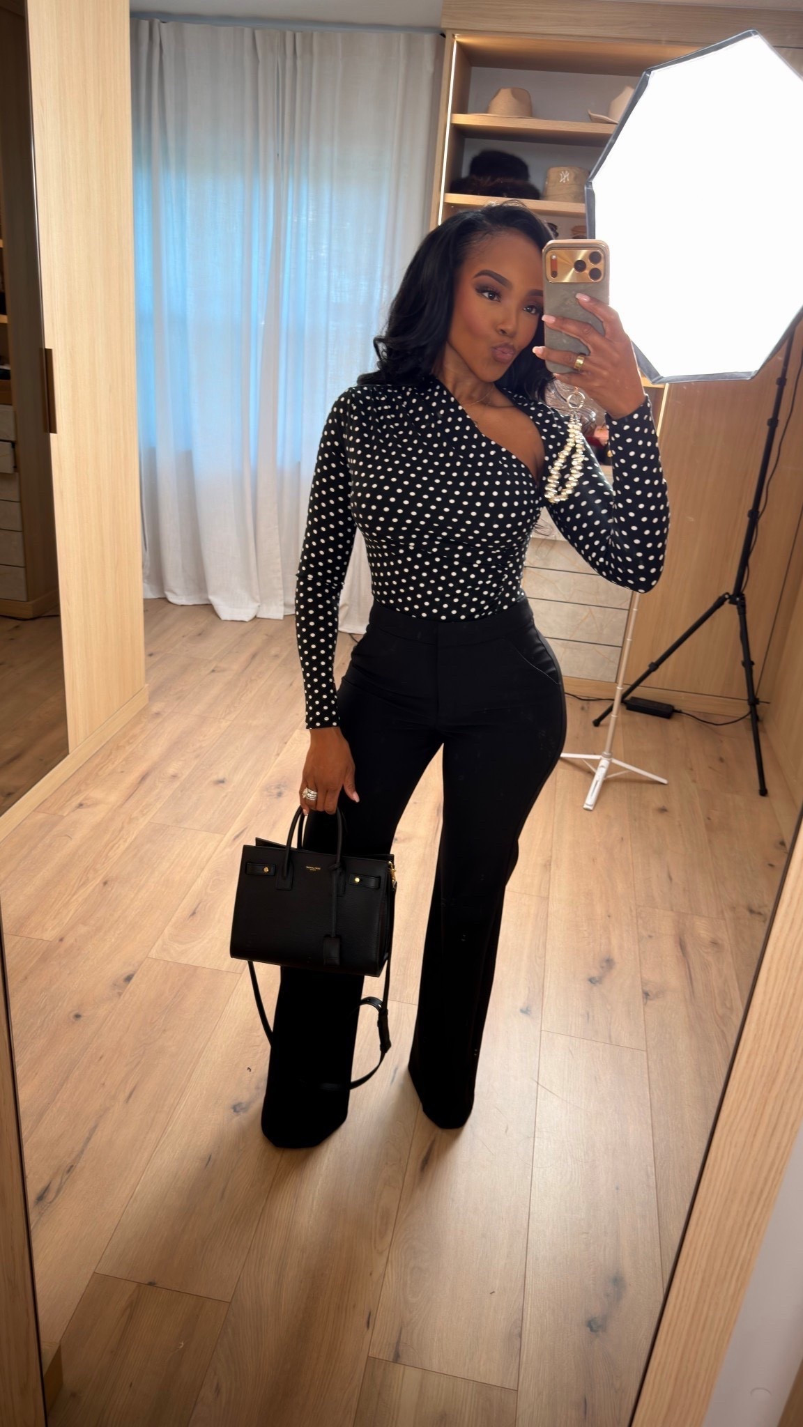 A polished black-and-white look that always delivers. The fitted polka dot top paired with tailored black pants creates a timeless silhouette that works for so many moments — elevated, flattering, and endlessly wearable.

Each piece can be styled multiple ways, which means the cost per wear drops quickly. This is the kind of outfit that fits into a long-term shopping strategy instead of living in your closet for one occasion.

Perfect for date nights, dinners, events, work-to-evening transitions, or anytime you want a chic, confident look without overthinking it.

📏 Sizing:
Top: Small  
Pants: 27 Long  
Shoes: True to size  
Bag & accessories: One size  
Height 5'4" | 138 lbs | Bust 34D | Waist 27" | Hips 40"

This look includes a classic polka dot top, tailored black pants, a structured handbag, and minimal accessories that keep everything clean and sophisticated.

Save this post to revisit later.

Follow me on Instagram and YouTube @kirasfashionfinds 

#LTKootd #LTKPetite