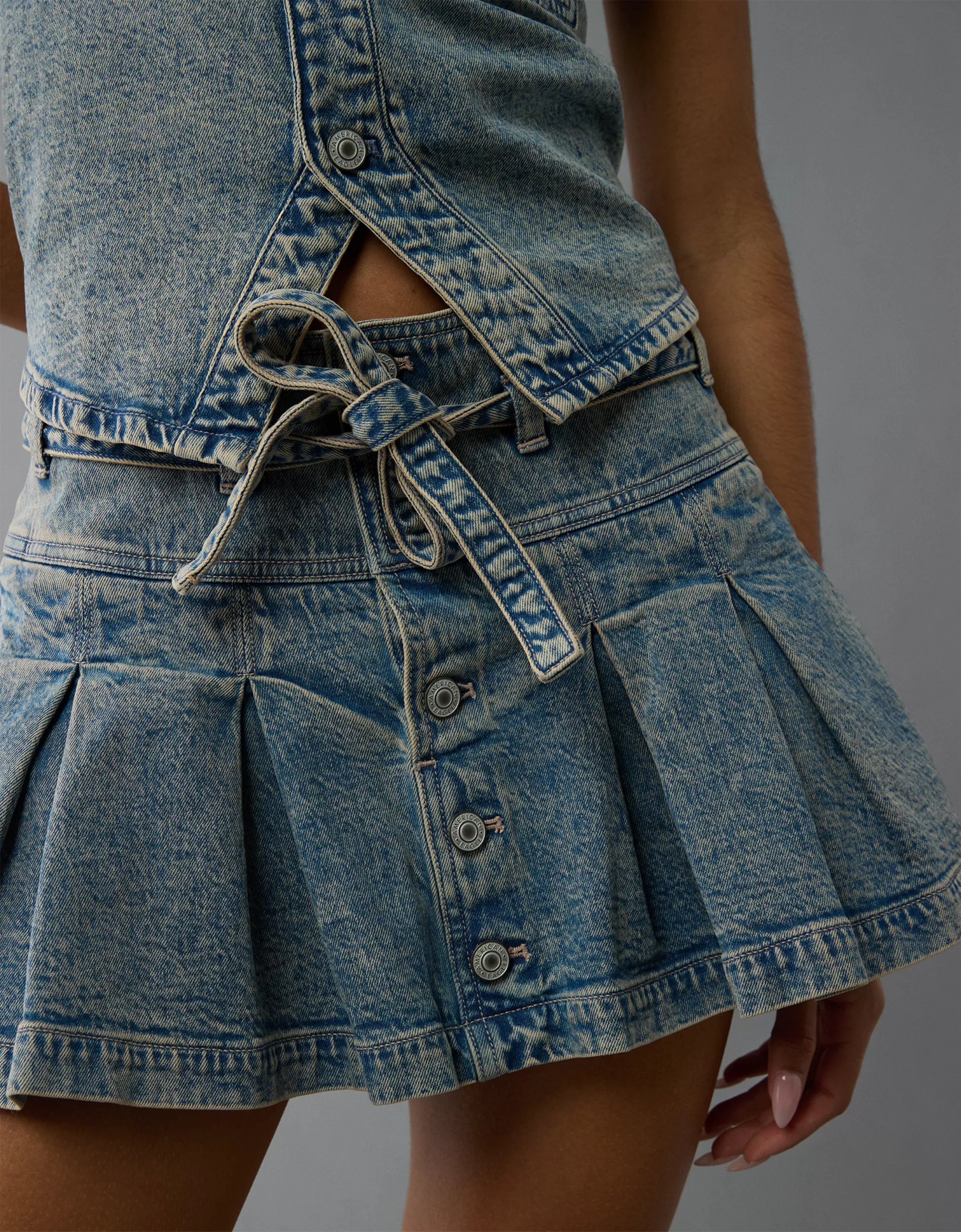 AE Stretch Low-Rise Belted Pleated Denim Mini Skirt | American Eagle Outfitters (US & CA)