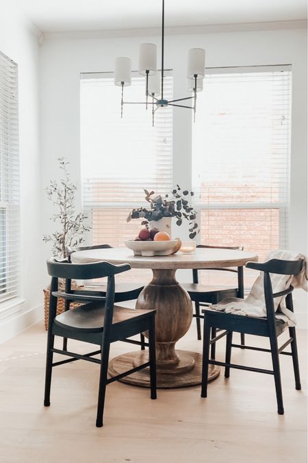 Breakfast nook, dining chairs, black chairs, pedestal table, round table, wood dining table, olive tree, basket, planter, studio mcgee

#LTKhome #LTKFind #LTKunder100