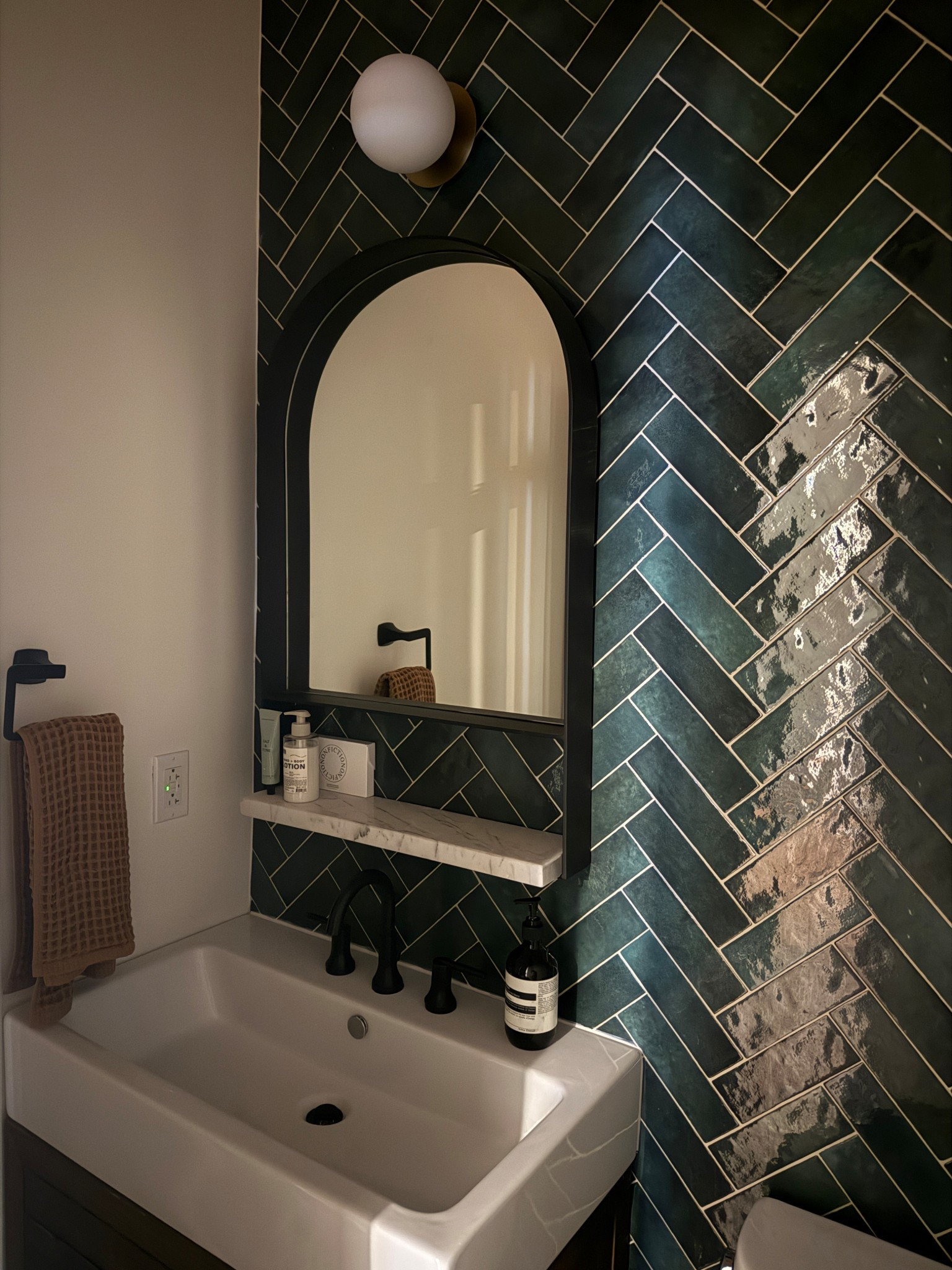 Powder room arch mirror vanity, hand soap, hand lotion, waffle knit hand towel

#LTKHome