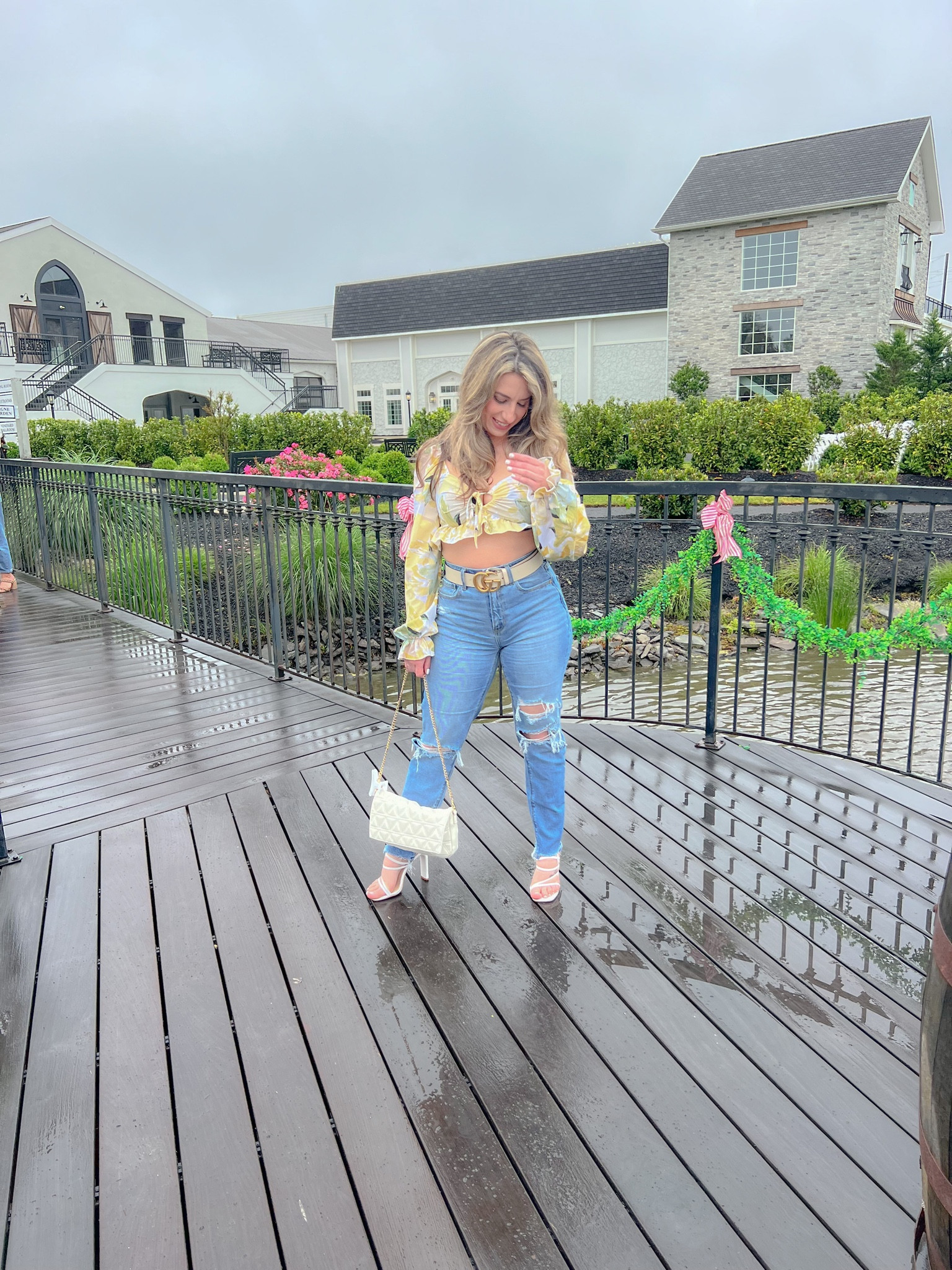 Im obsessed with this whole outfit! My jeans are on sale right now for $35.99. I’m wearing a size 2 in the color blue. My bag is no longer available but I linked a similar one along with similar earrings. Top runs small size up unless you don’t mind it being very cropped. Im wearing it in 4(S). Happy Shopping! 

#LTKunder50 #LTKsalealert #LTKSeasonal