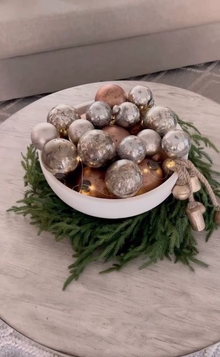 Christmas flash back! Love doing this for a Christmas centerpiece!! Just grab a wreath, large bowl, ornaments, bells  and of course battery twinkle lights!!  So simple and easy!!! I linked up all I could and similar items!! #christmasdecor #christmas #christmascenterpiece 

#LTKhome #LTKSeasonal #LTKHoliday