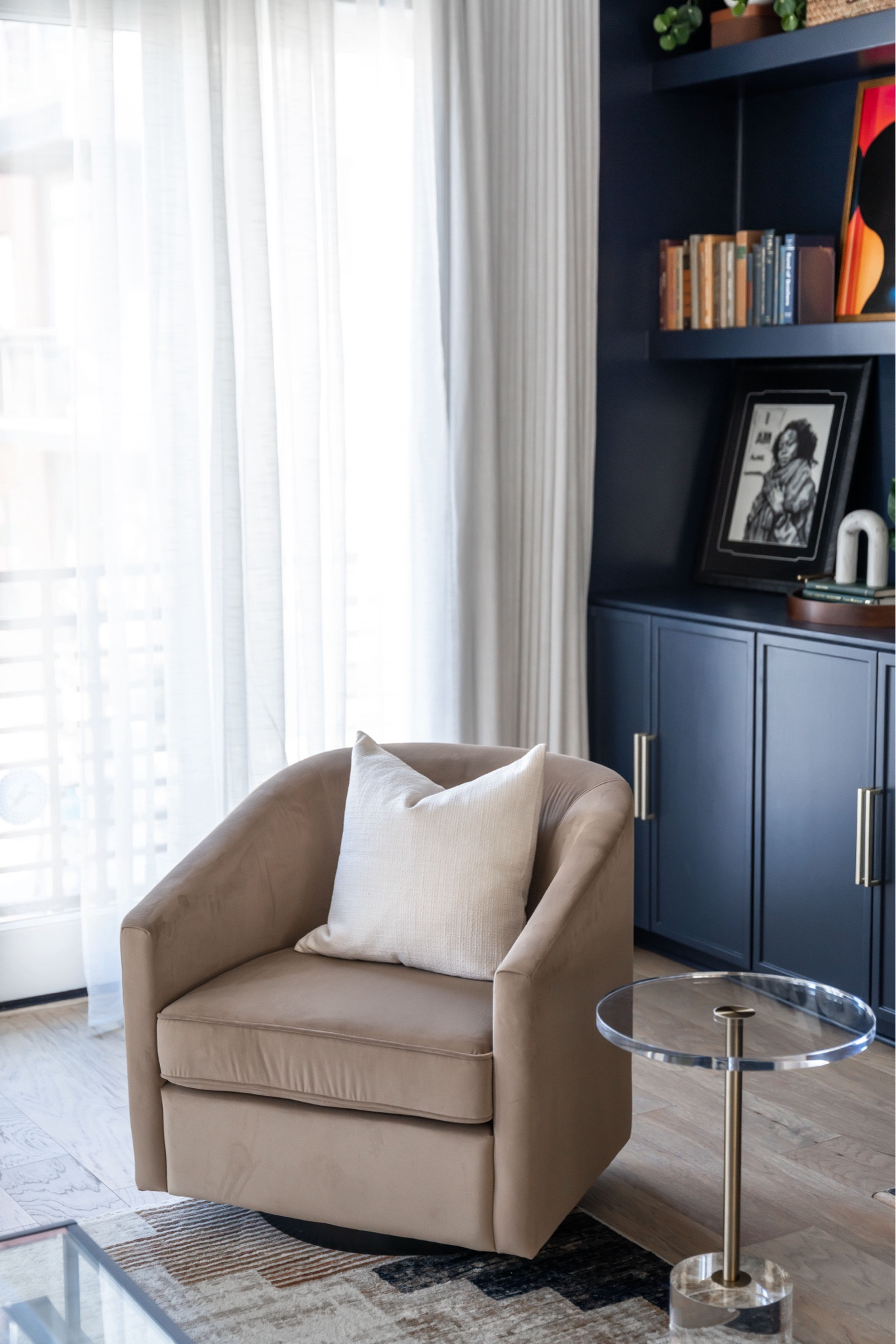 Cozy swivel chair in navy living room 

#LTKHome