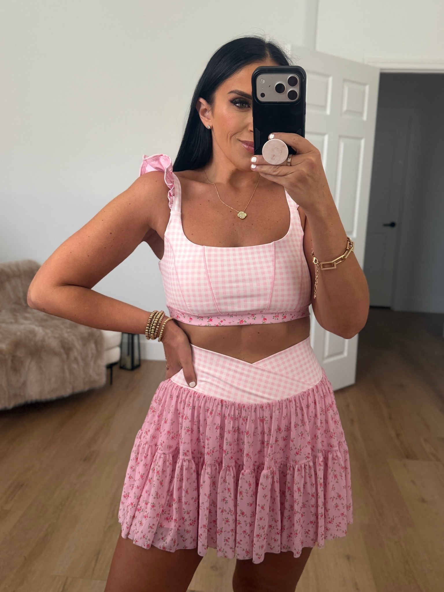 Blogilates Women's Ruffle Corset Sports Bra - Pink Gingham wearing size medium. Blogilates Women's Ballerina Skort - Pink Gingham wearing size medium. 
