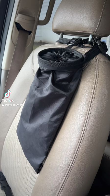 A lot of people are always posting the same car garbage can over and over again. I love this one because it's flat, it doesn't take up any space, but it still holds a ridiculous amount. It's easy to throw things in and they won't fall out. And if it gets yucky you can just rinse it in the sink and it's good as new. It comes in a two pack, one for each car

#LTKHome #LTKGiftGuide #LTKVideo