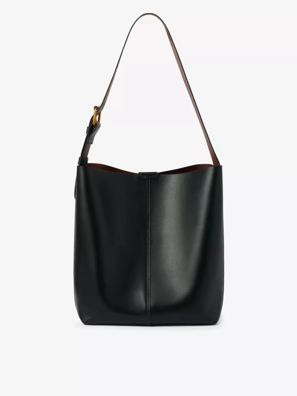 Saudade logo-embossed leather shoulder bag | Selfridges